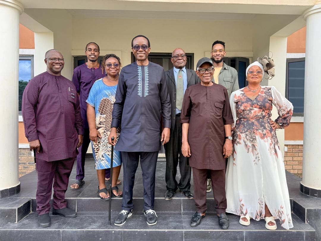 Guests on the steps of the guest house at the dedication