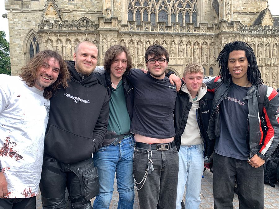 Young bikers in front of Exeter Cathedral
