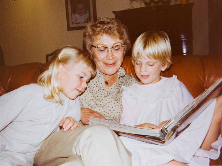 My little sister and me, reading with my grandma