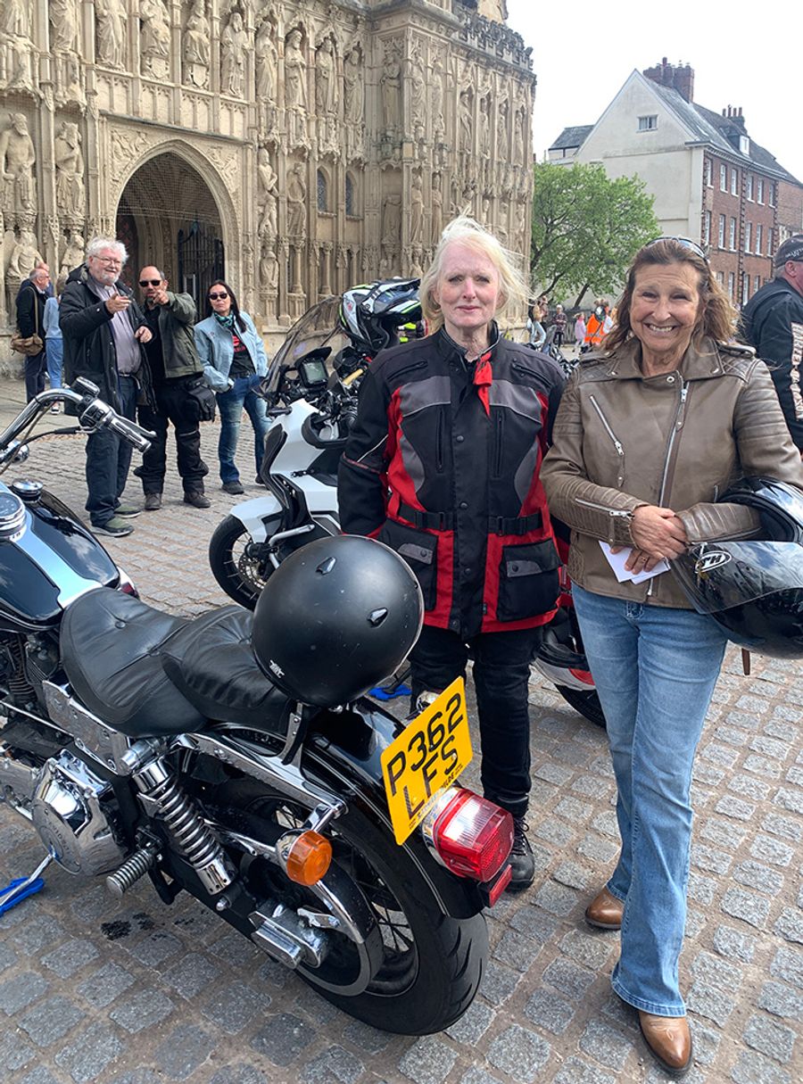 Lady bikers in front of Exeter cathedral