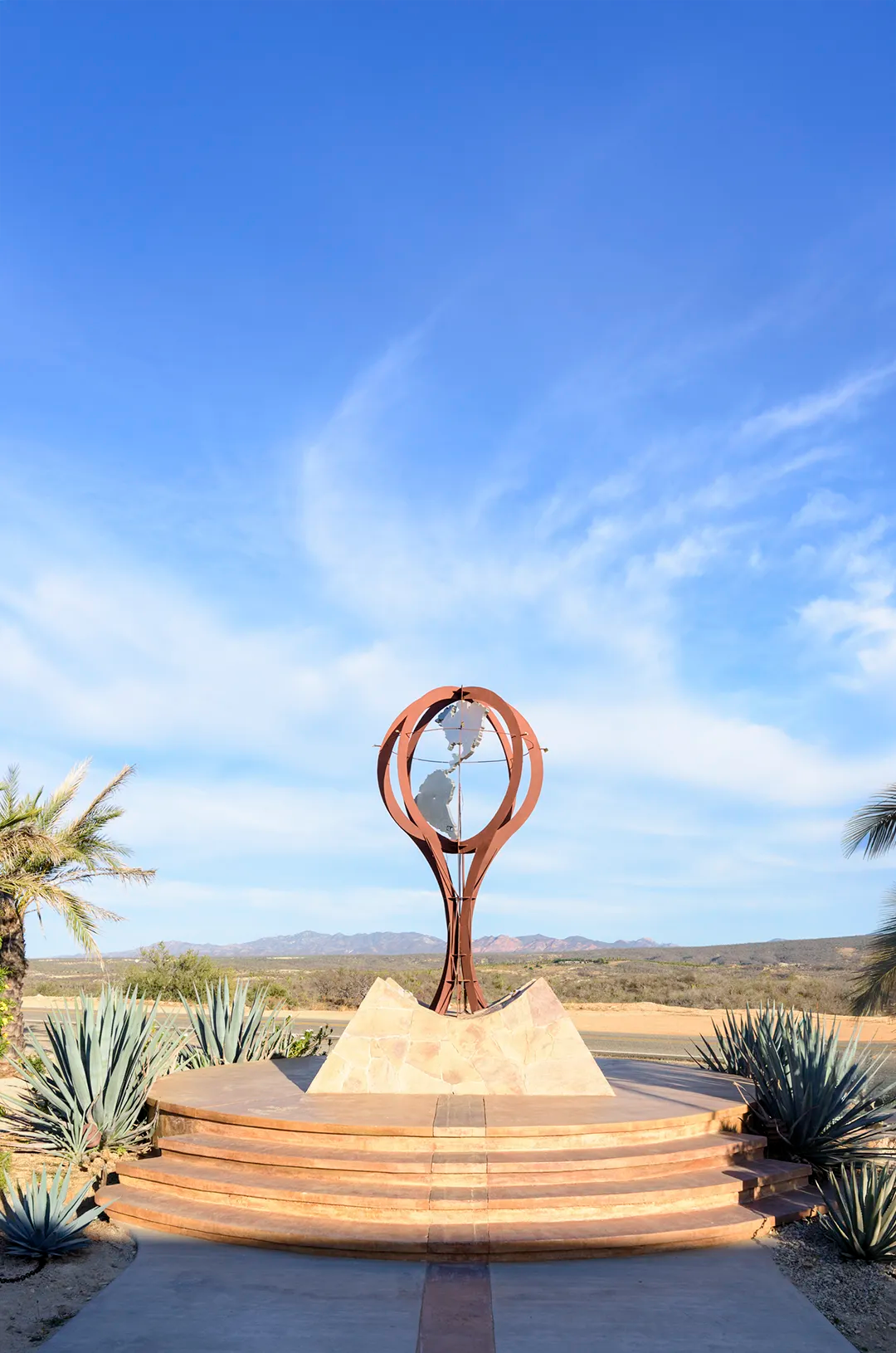 Tropic of Cancer Monument in Baja California Sur, iconic geographic landmark surrounded by desert landscape and blue skies.