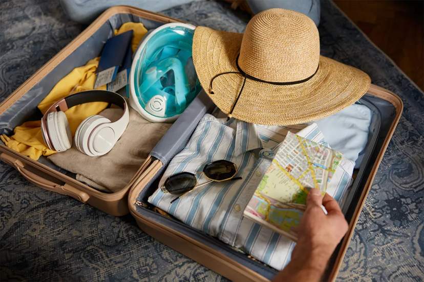 Couple enjoying a guided dolphin swim experience, interacting up close with a dolphin at a marine park
