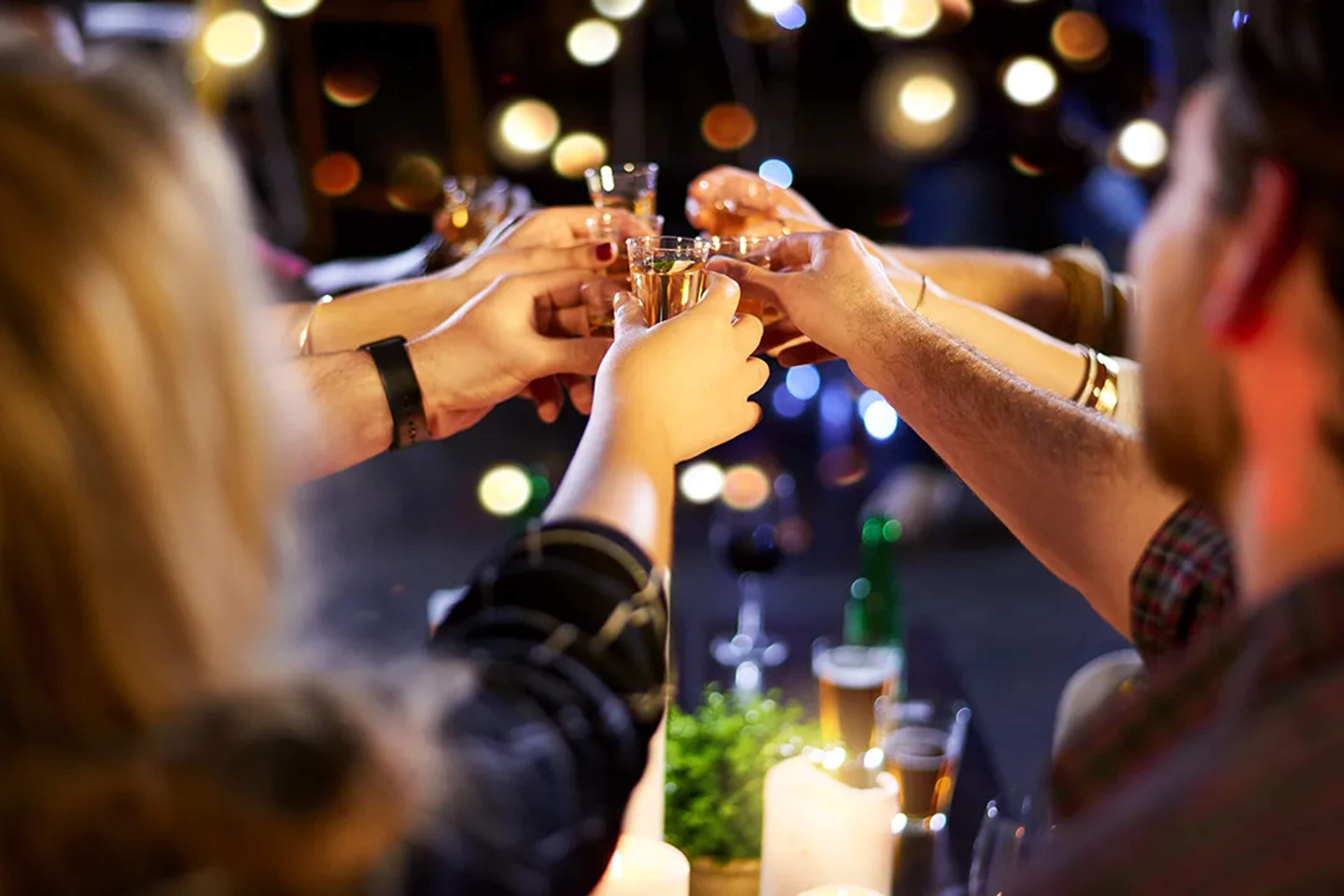 Friends tasting tequila