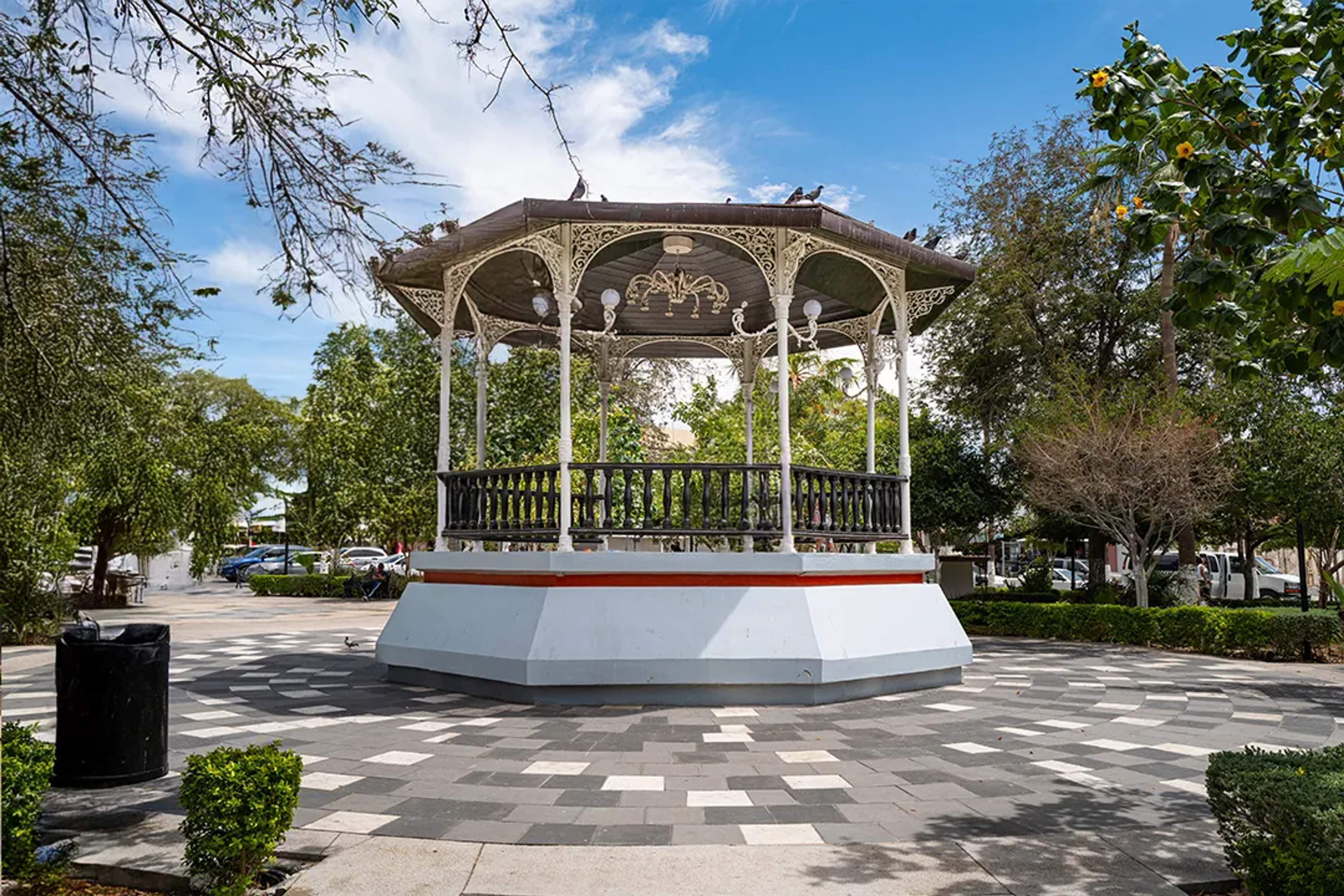 Historic kiosko in La Paz main square surrounded by trees, gardens and a peaceful Baja atmosphere