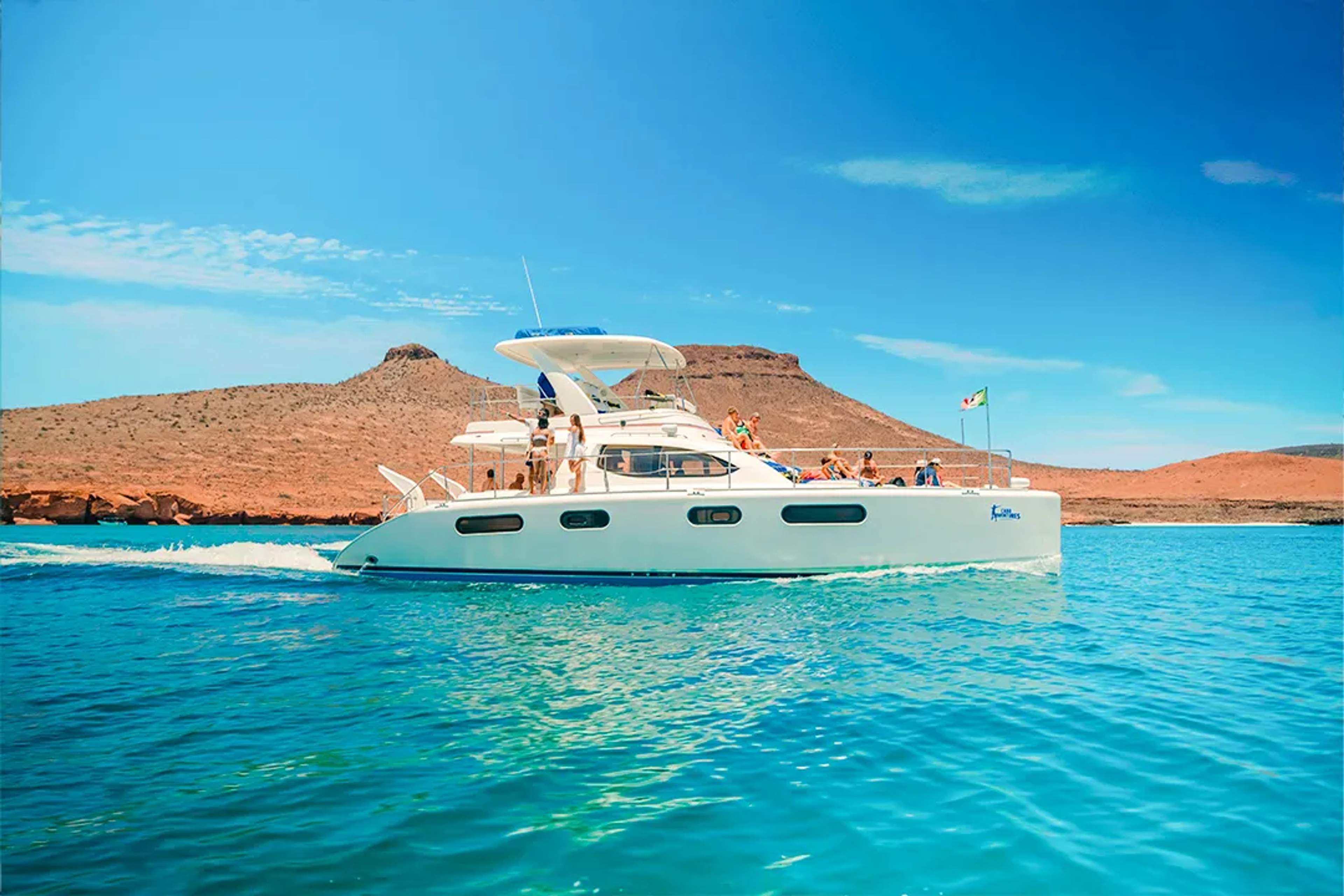 Luxury catamaran sailing near Balandra Beach during a scenic island cruise in La Paz, Baja California Sur.