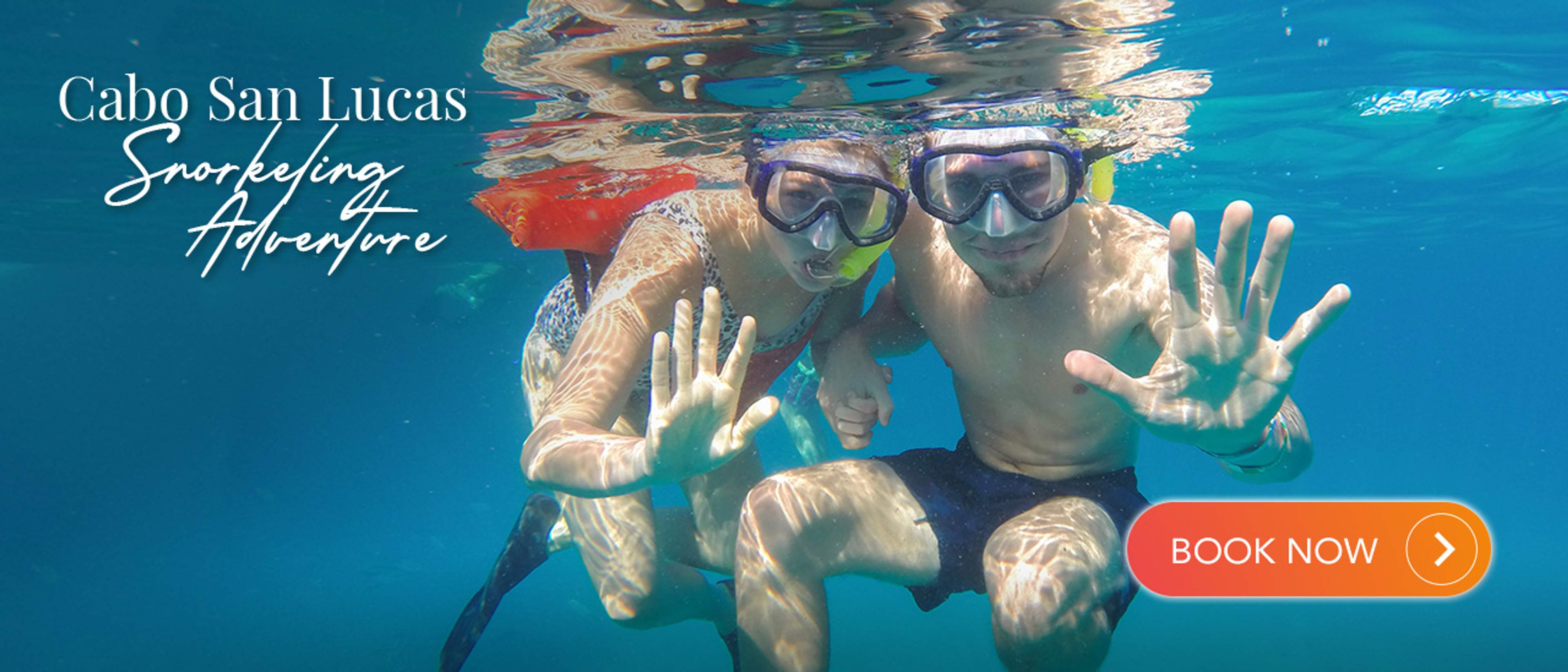 Couple enjoying a snorkeling adventure in Cabo San Lucas, ready to explore the ocean.