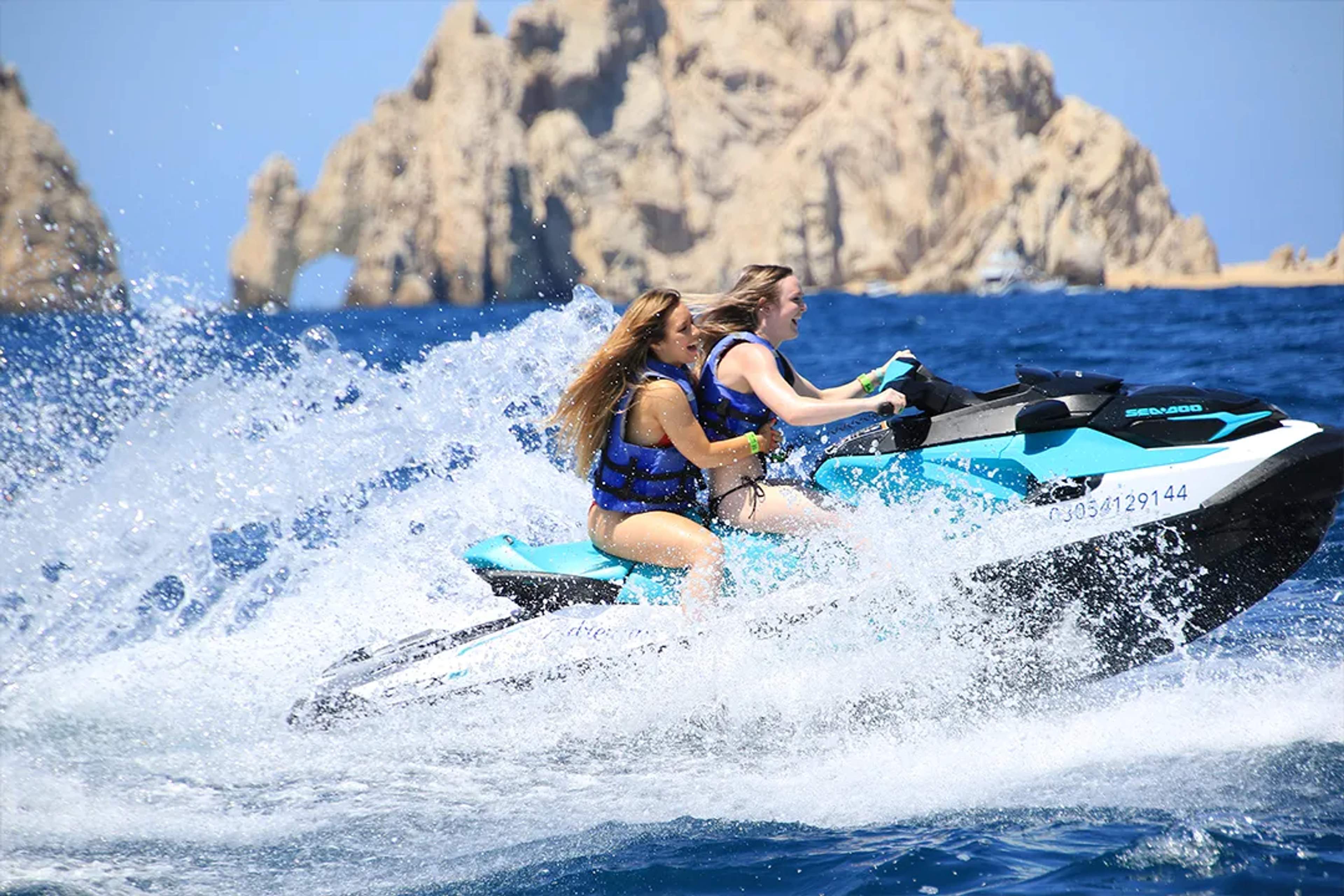 Jet ski ride in Cabo San Lucas near the Arch with ocean waves, adventure activity, and coastal scenery