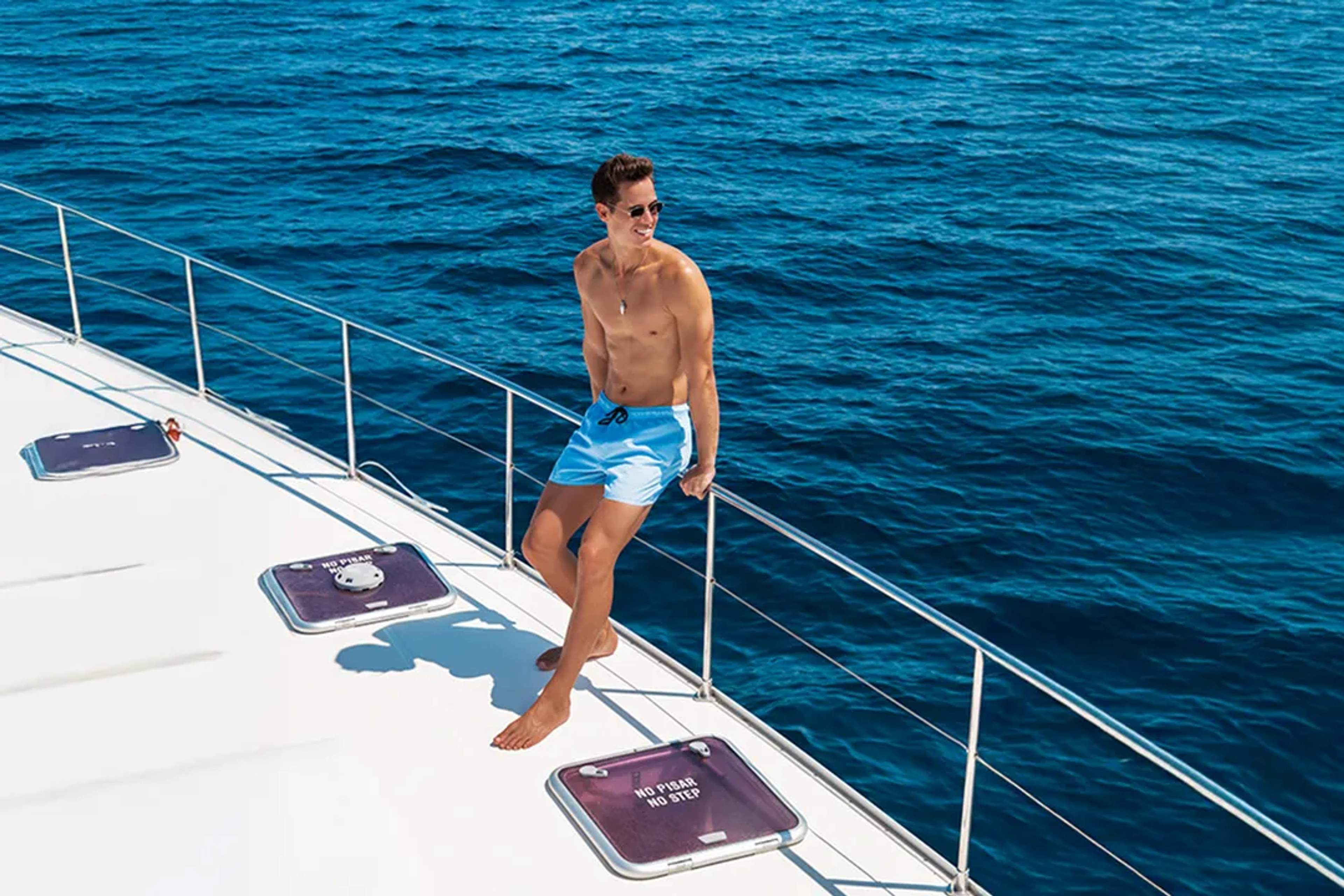 Guest relaxing aboard a luxury catamaran during a Puerto Vallarta sailing and snorkeling tour on Banderas Bay