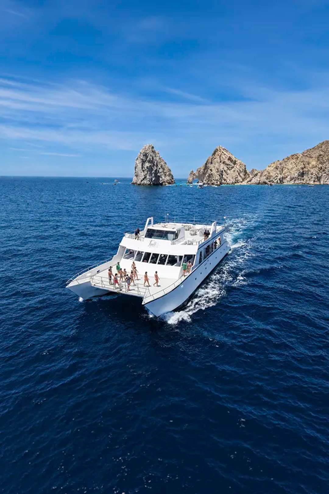 Oceanus snorkel catamaran cruise in Cabo San Lucas sailing near the Arch with ocean views and social vibe