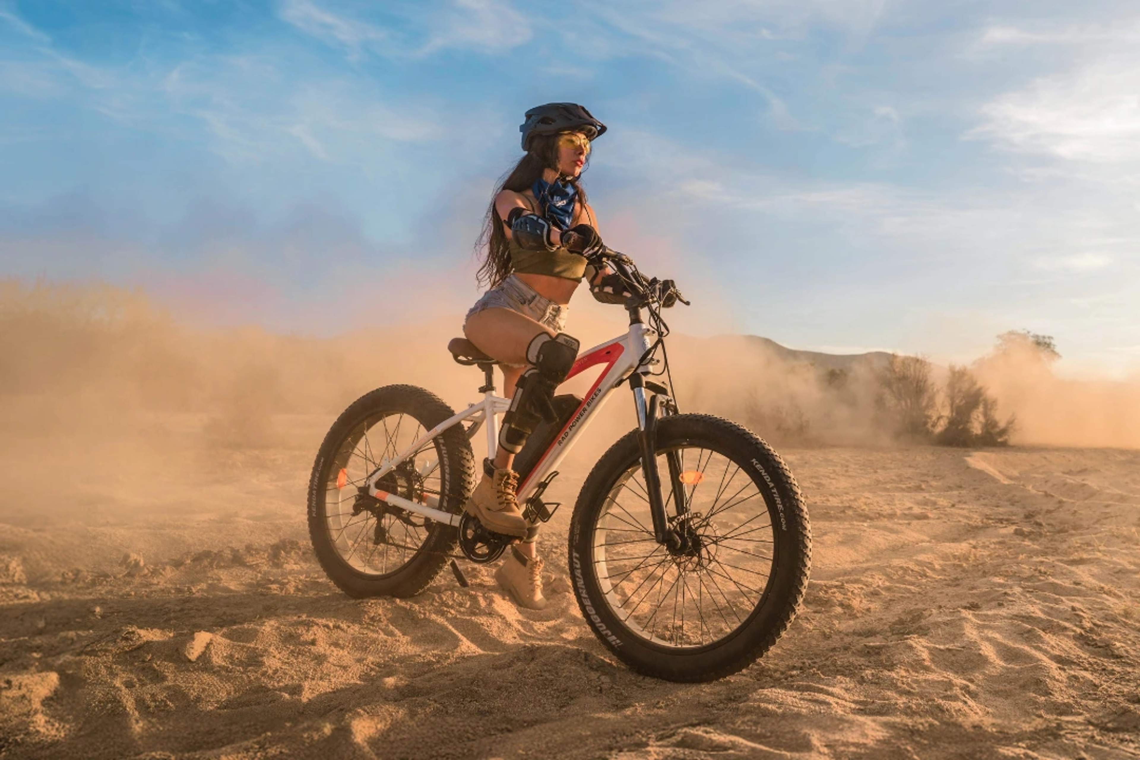 Woman riding an electric bike through the Baja desert on a Cabo Adventures tour.