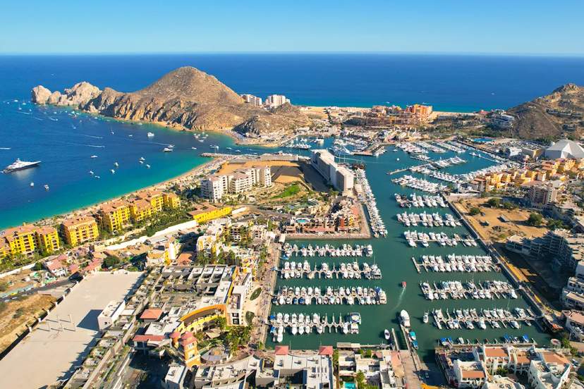 Aerial view of Cabo San Lucas Marina, Land’s End and Medano Beach during scenic luxury boat tour
