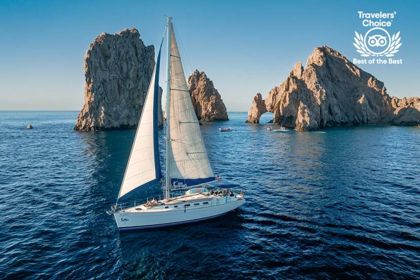 A sailboat gliding on calm waters under a clear blue sky, with a "Best of the Best" badge.