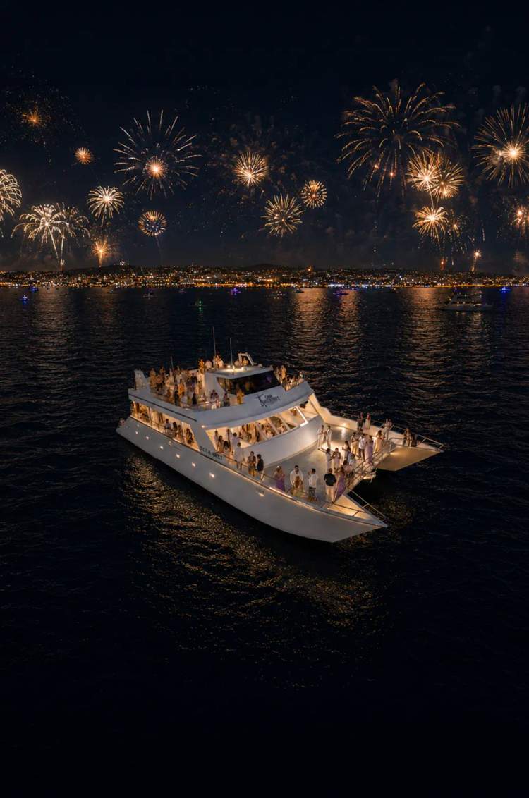 Oceanus catamaran by Cabo Adventures hosts a Disco Fever New Year’s Eve party beneath fireworks over Cabo.
