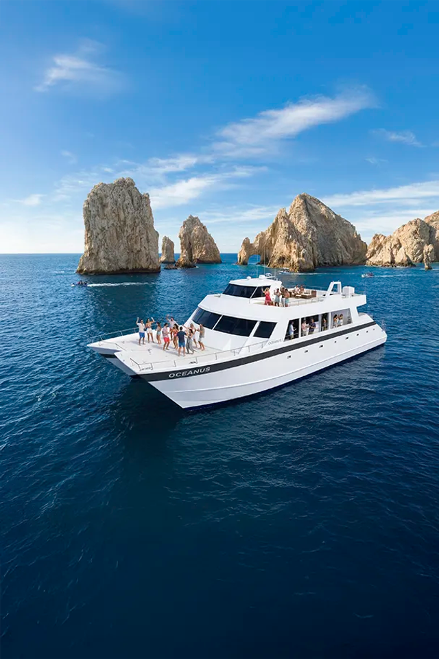 Oceanus snorkel catamaran cruise in Cabo San Lucas sailing near the Arch with ocean views and social vibe