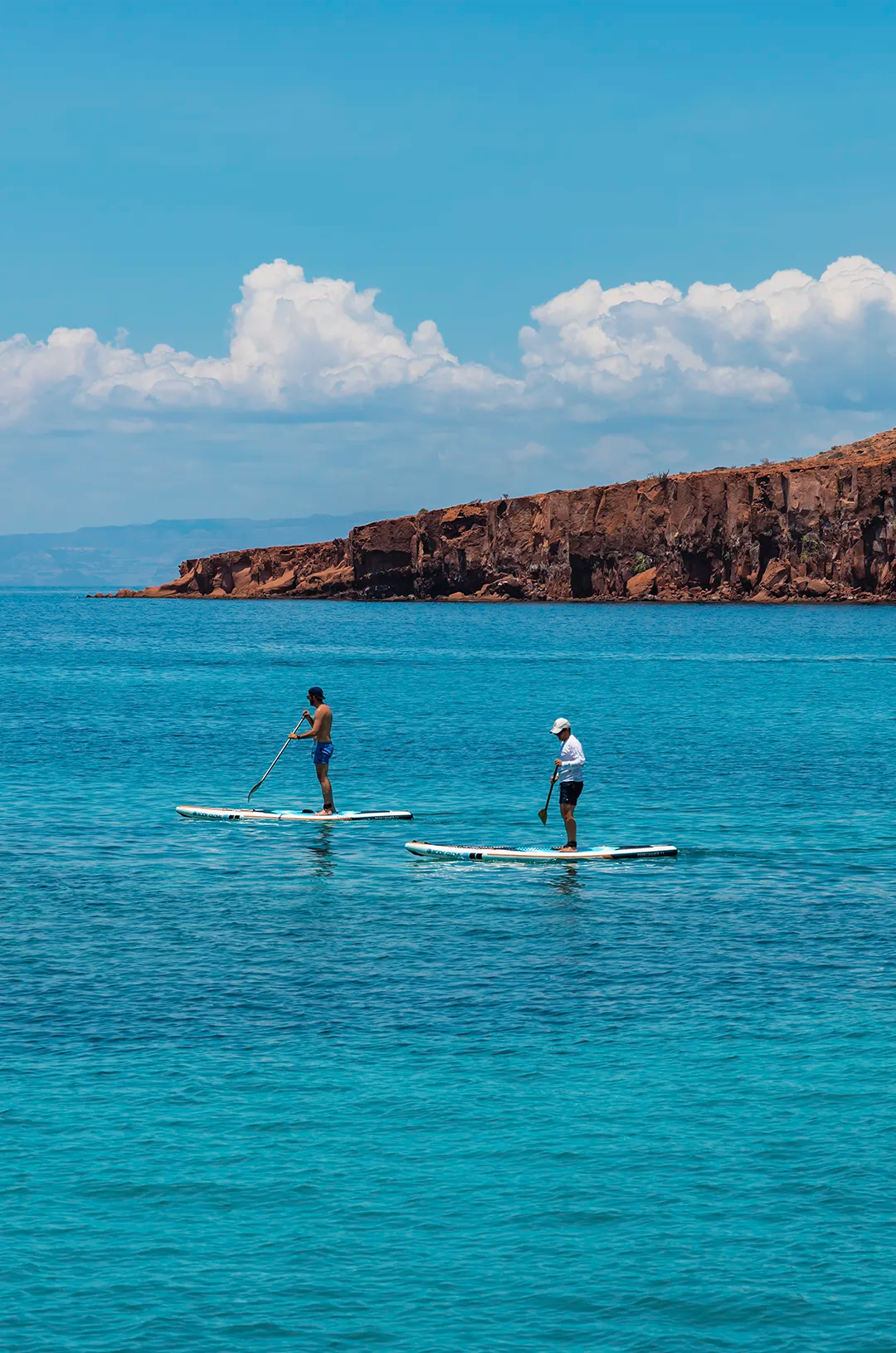 Couple paddleboarding in the turquoise waters of the Sea of Cortez near La Paz, Baja California Sur.