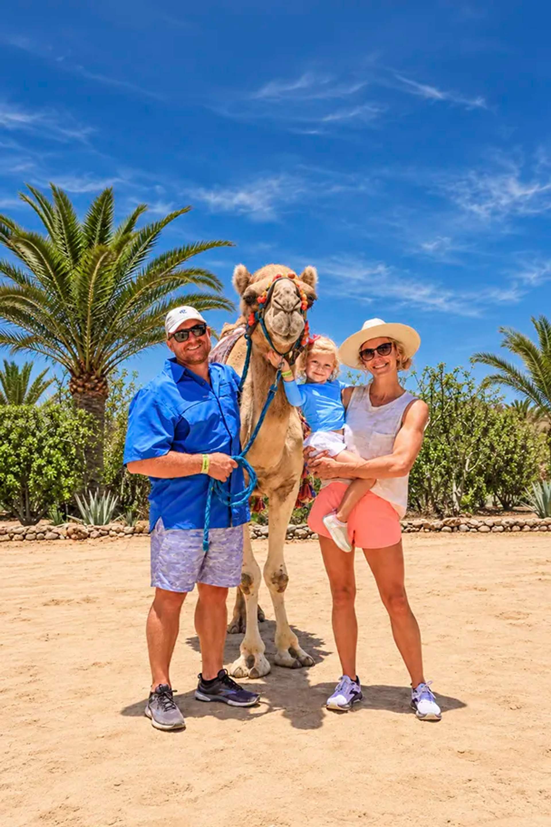 A family poses with a camel during a Cabo Adventures experience at Tierra Sagrada in Los Cabos.