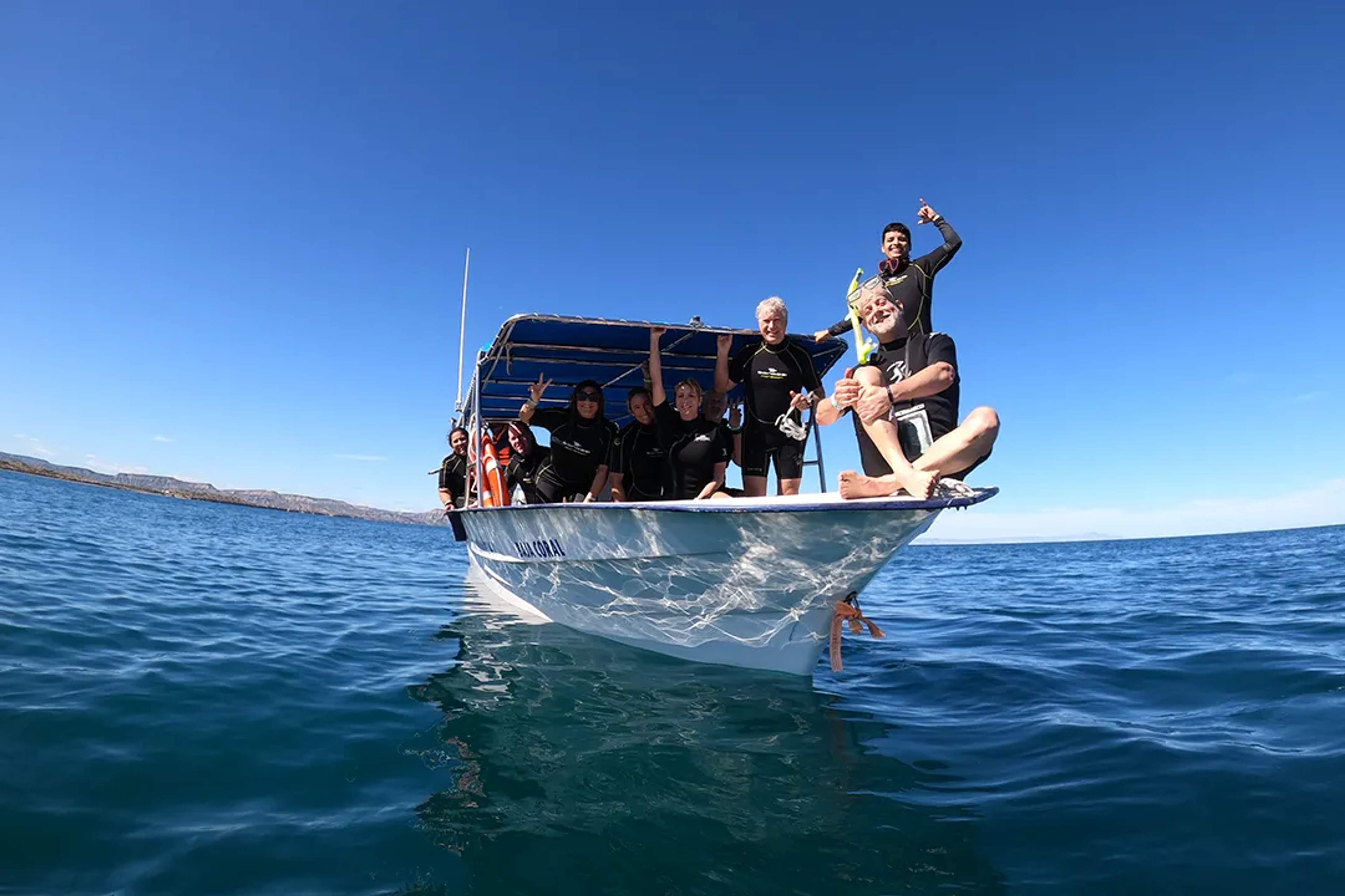 Group of snorkelers on a boat tour in the Sea of Cortez, Baja California Sur, ready for adventure.