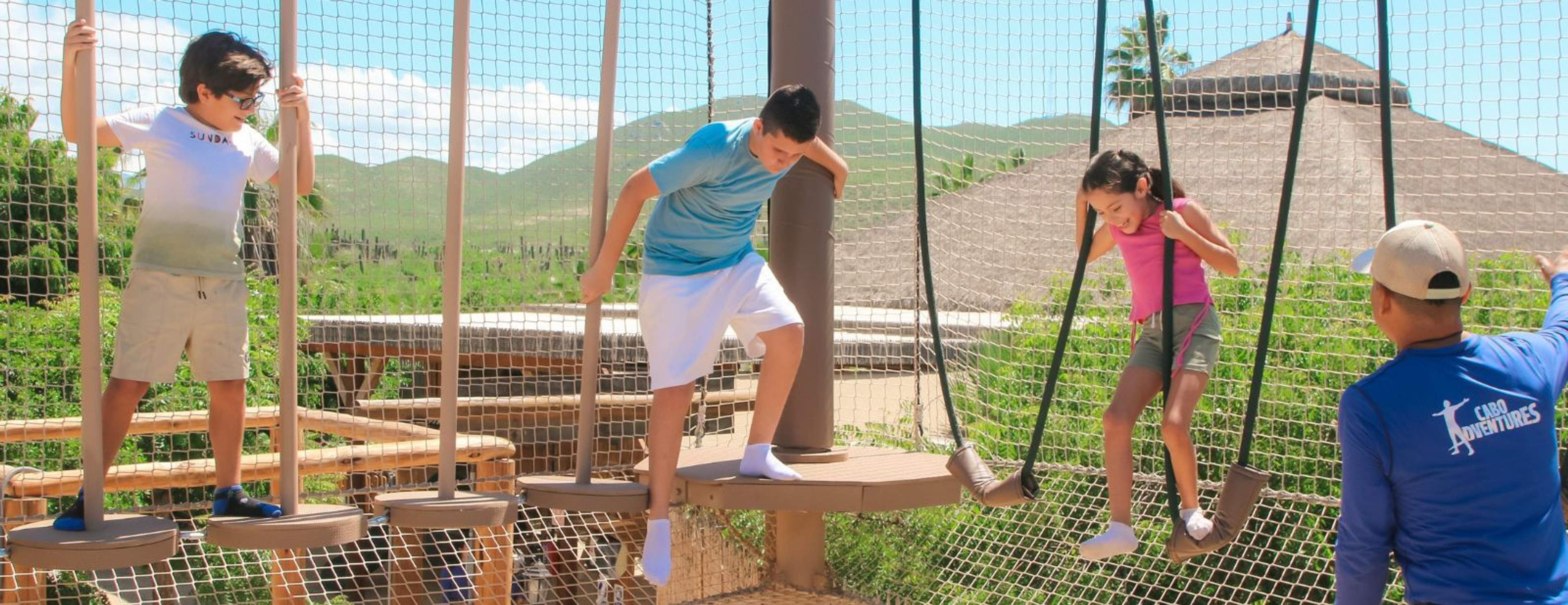 Kids enjoying adventure ropes course at Tierra Sagrada Cabo, safe family activity in Baja