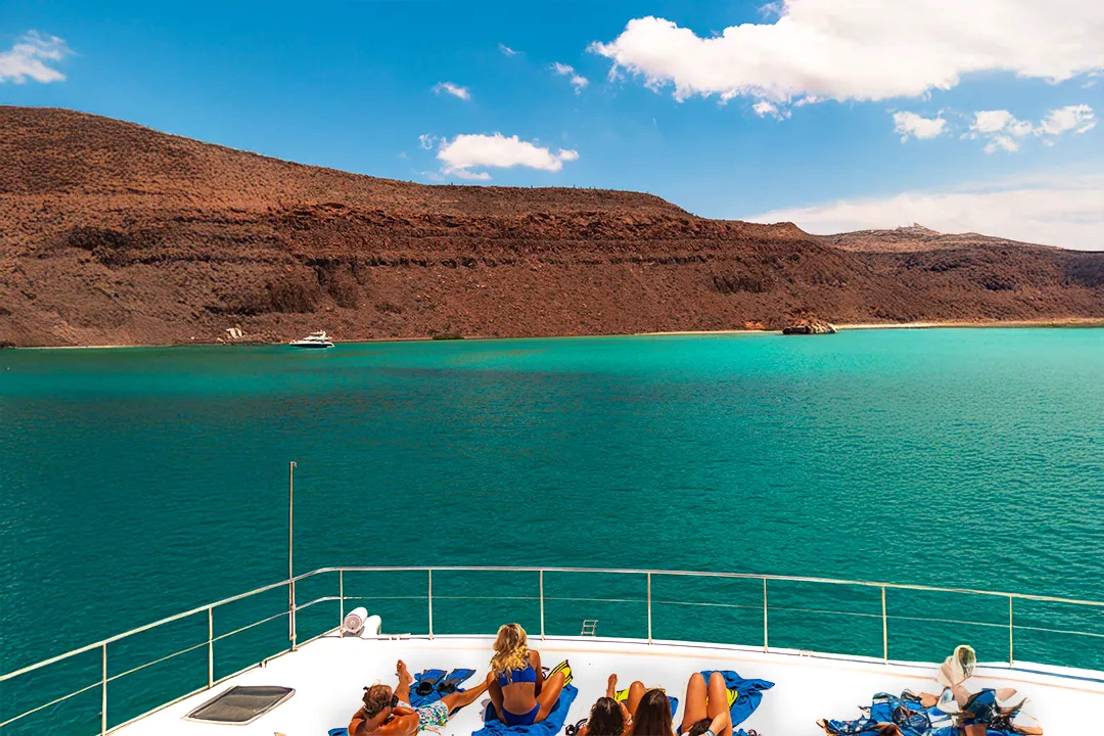 Guests Relaxing Aboard A Yacht In Balandra Bay Surrounded By Turquoise Waters Near La Paz, Baja