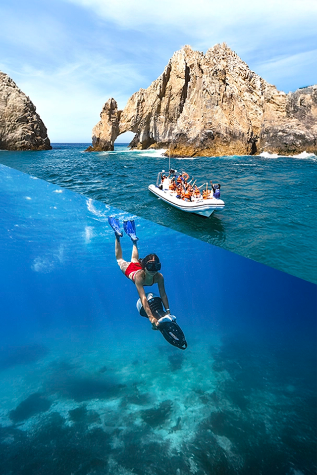 A boat with tourists in life jackets near the famous Arch of Cabo San Lucas, with clear blue waters and rocky cliffs.