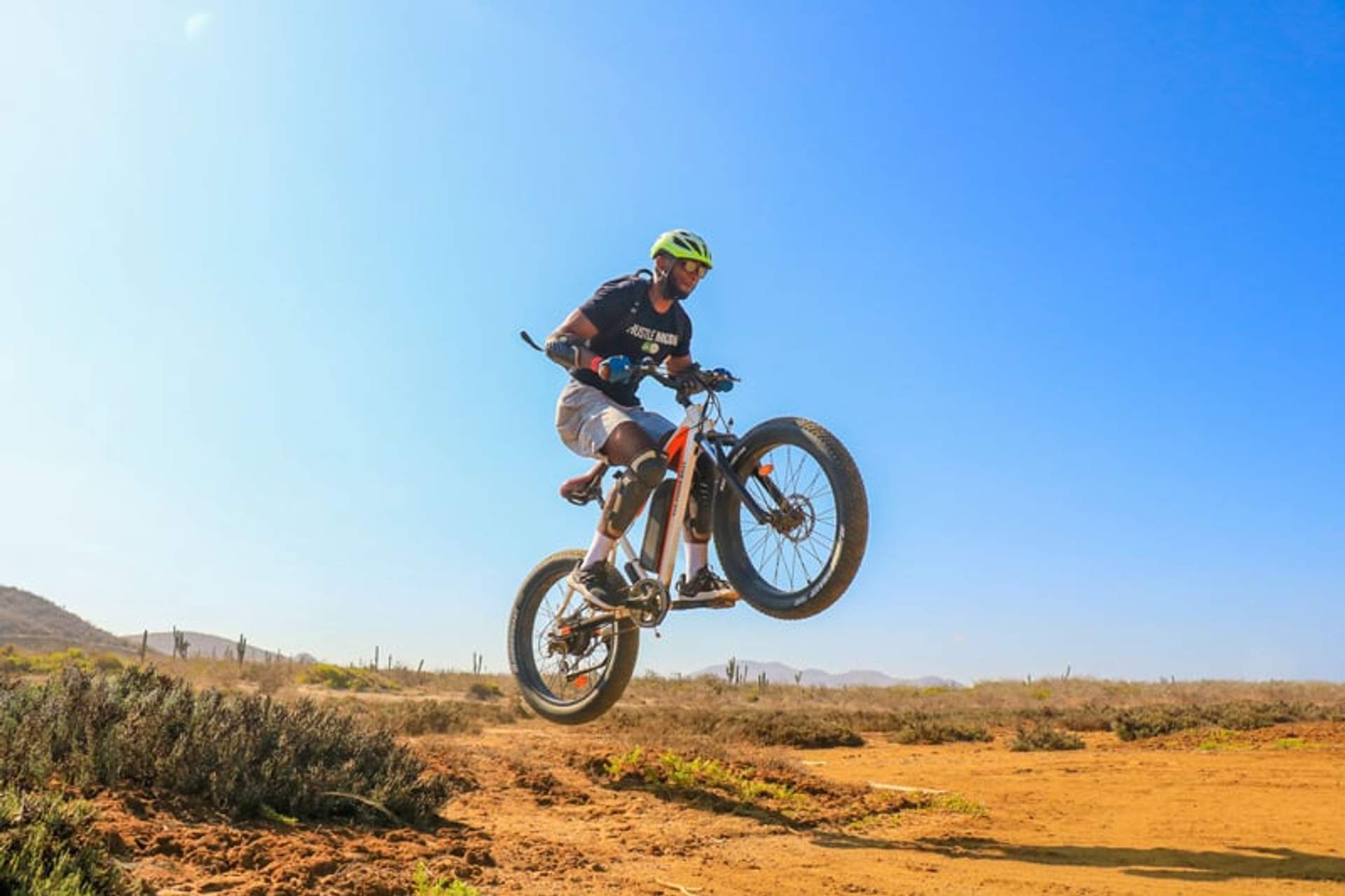 Cycling on sand on a morning sun at Cabo