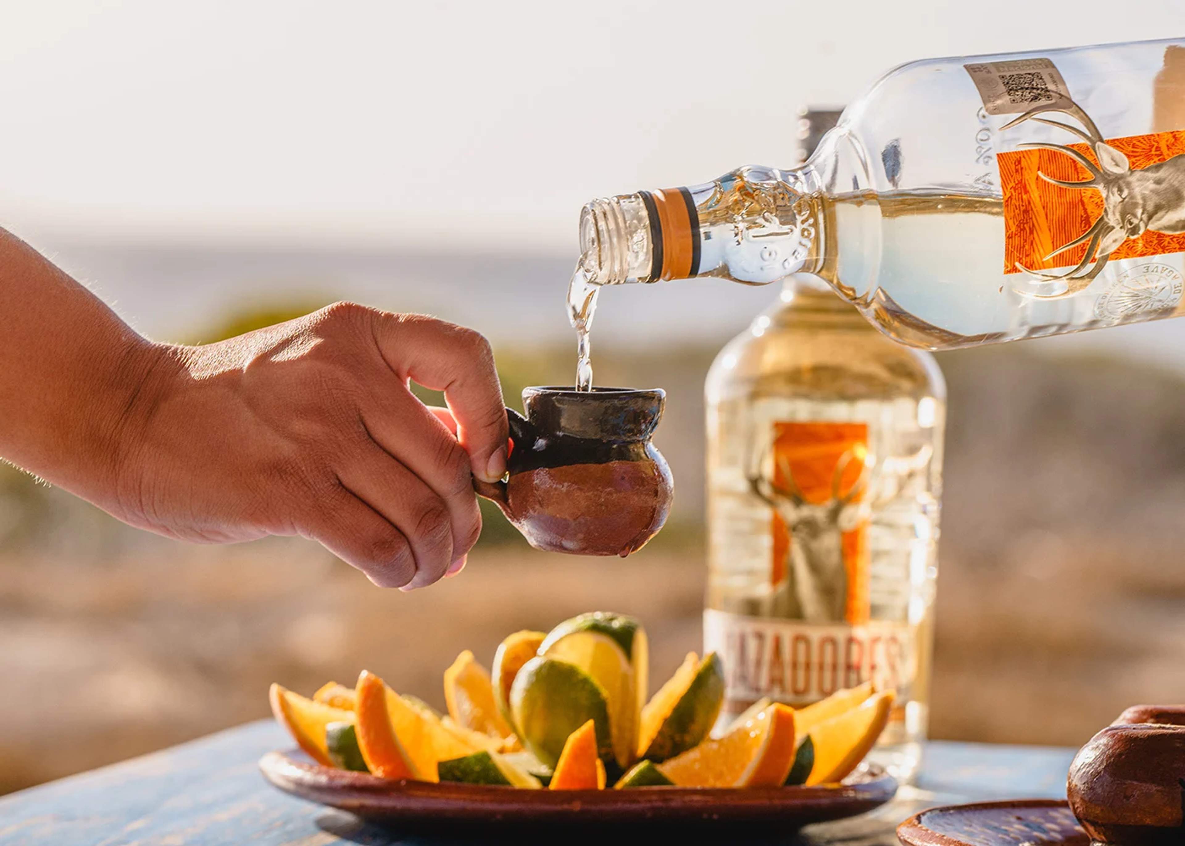 Shot od tequila with oranges and lemons