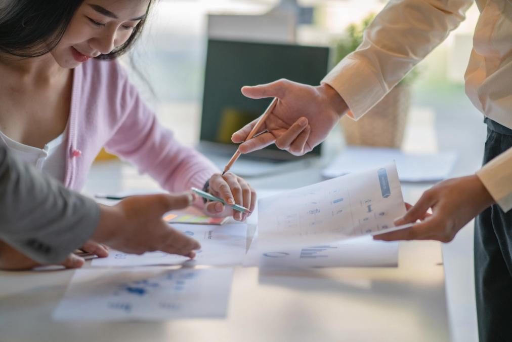 People working while looking at documents