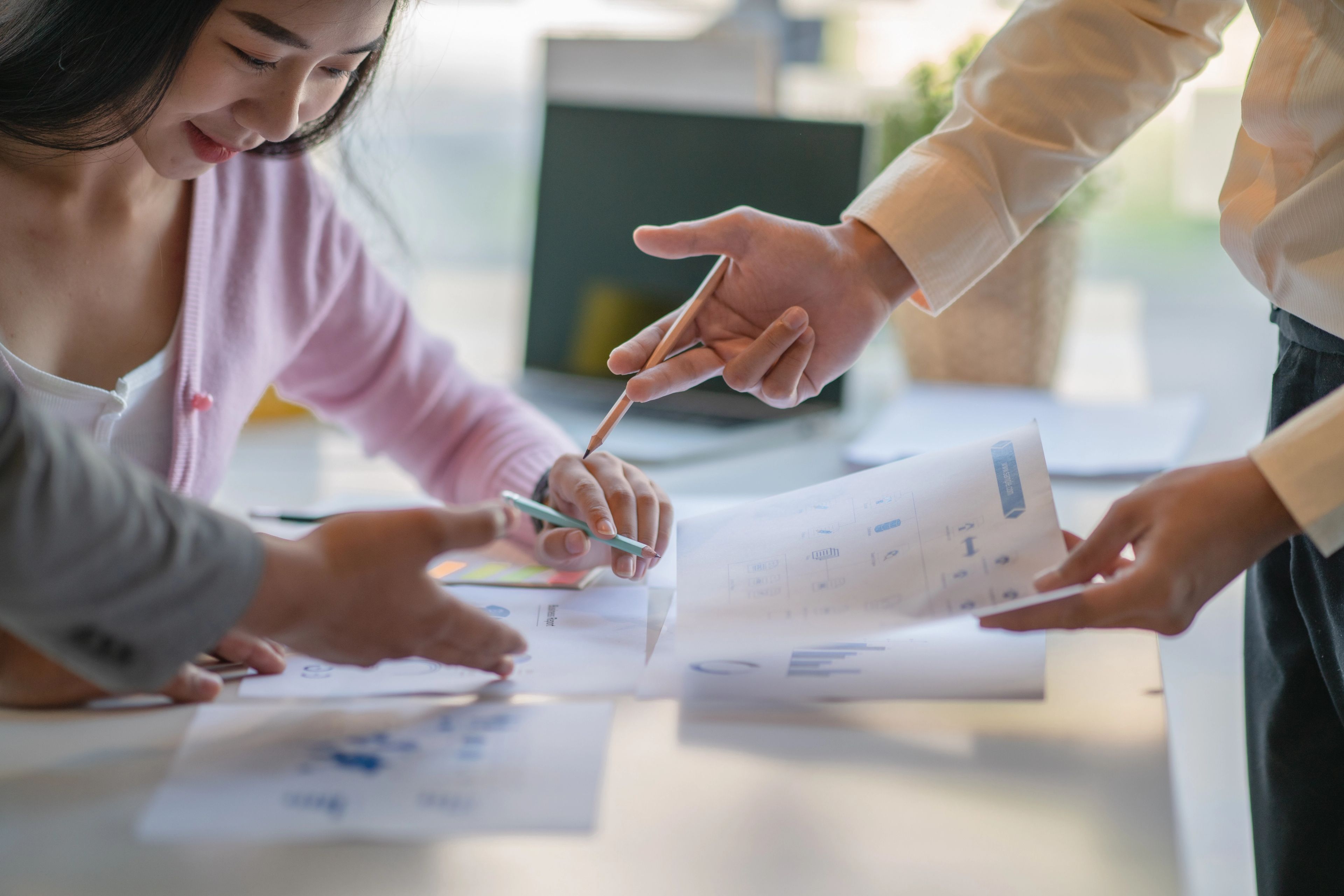 People working while looking at documents