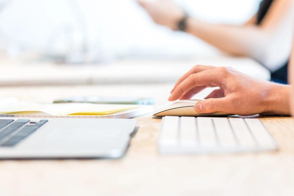 man typing on laptop