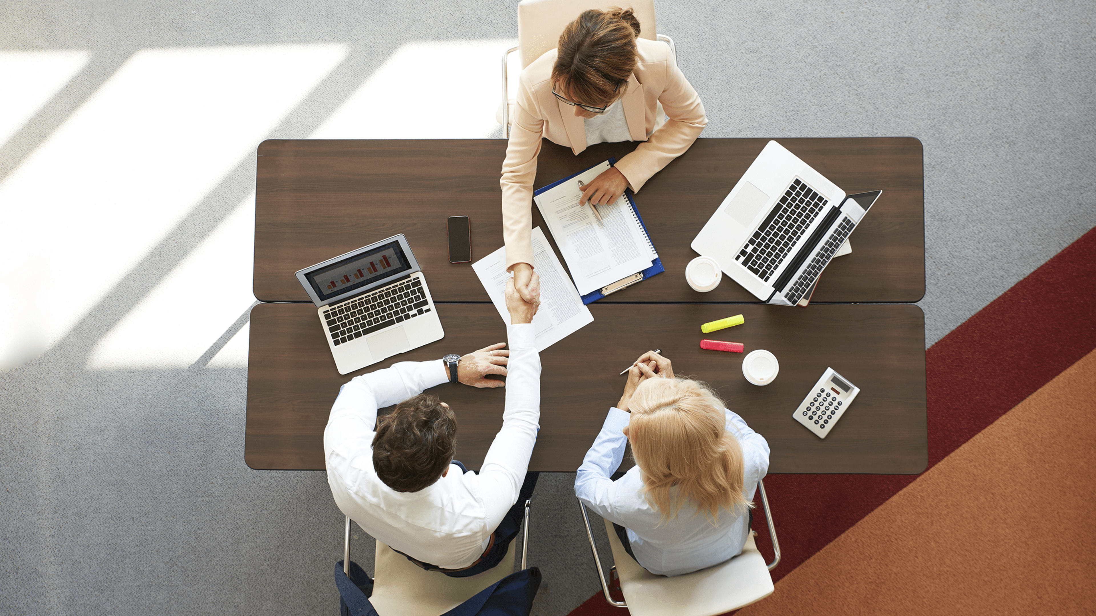 Group of professionals working at desk 