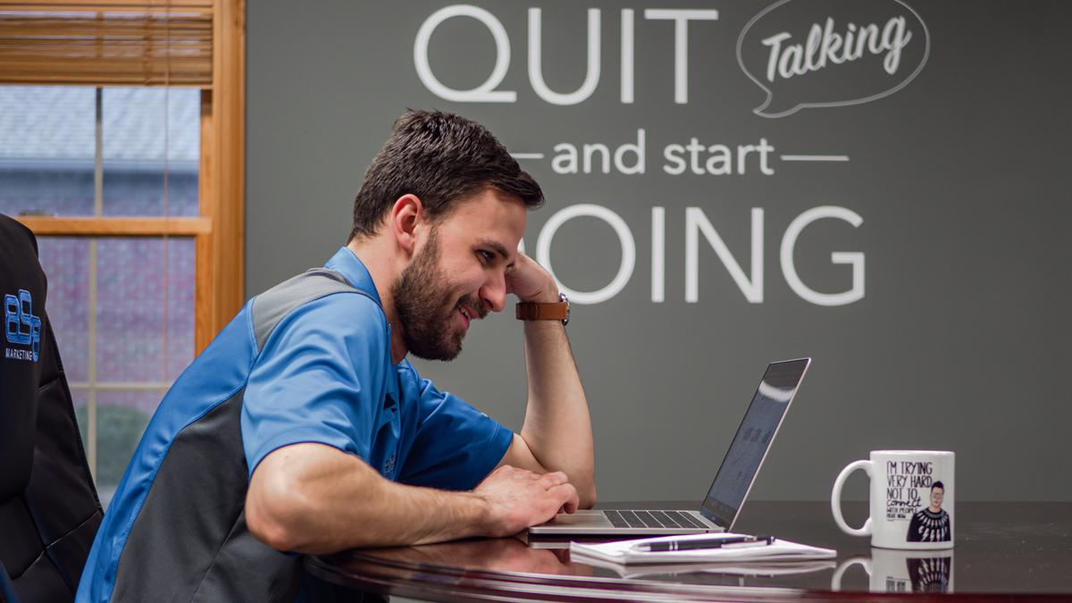 digital marketer working on laptop