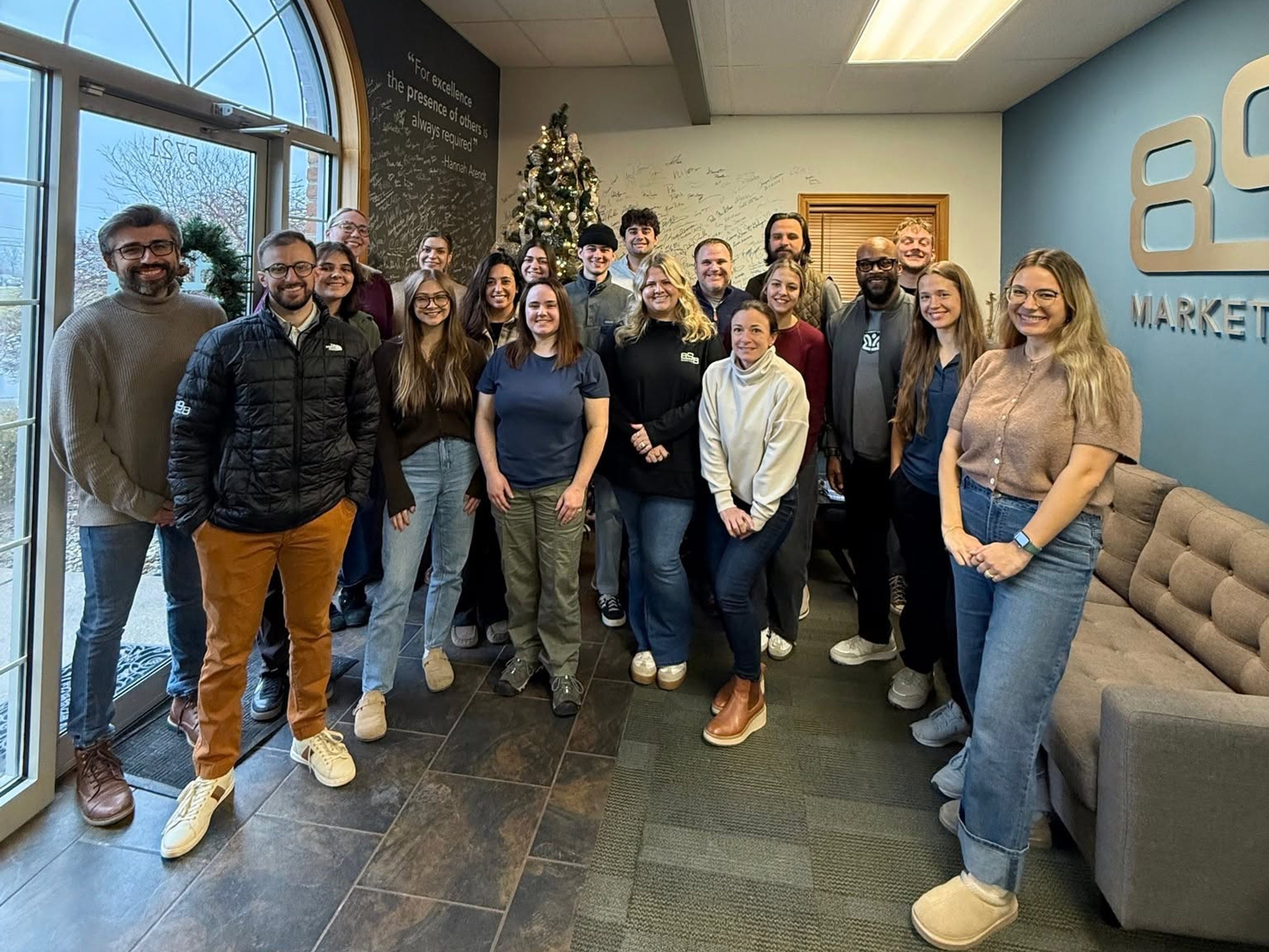 Photo of 898 employees standing in lobby of Canfield office