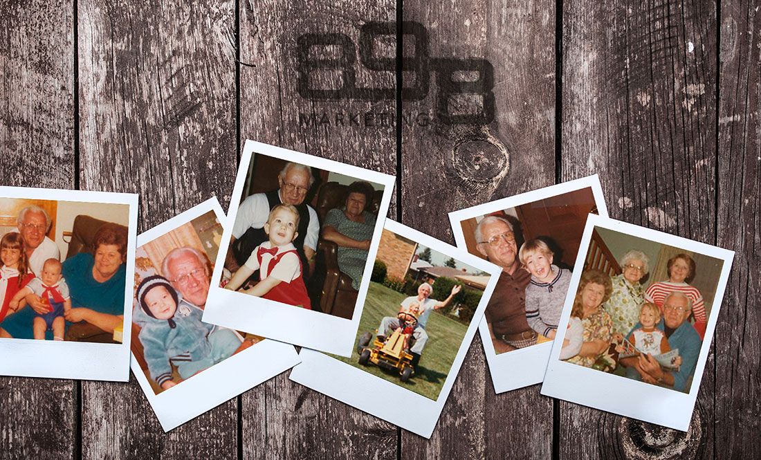 Vintage family polaroid photos on a wood background with the 898 Marketing logo