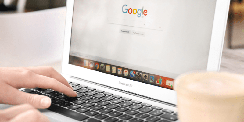 woman typing into Google