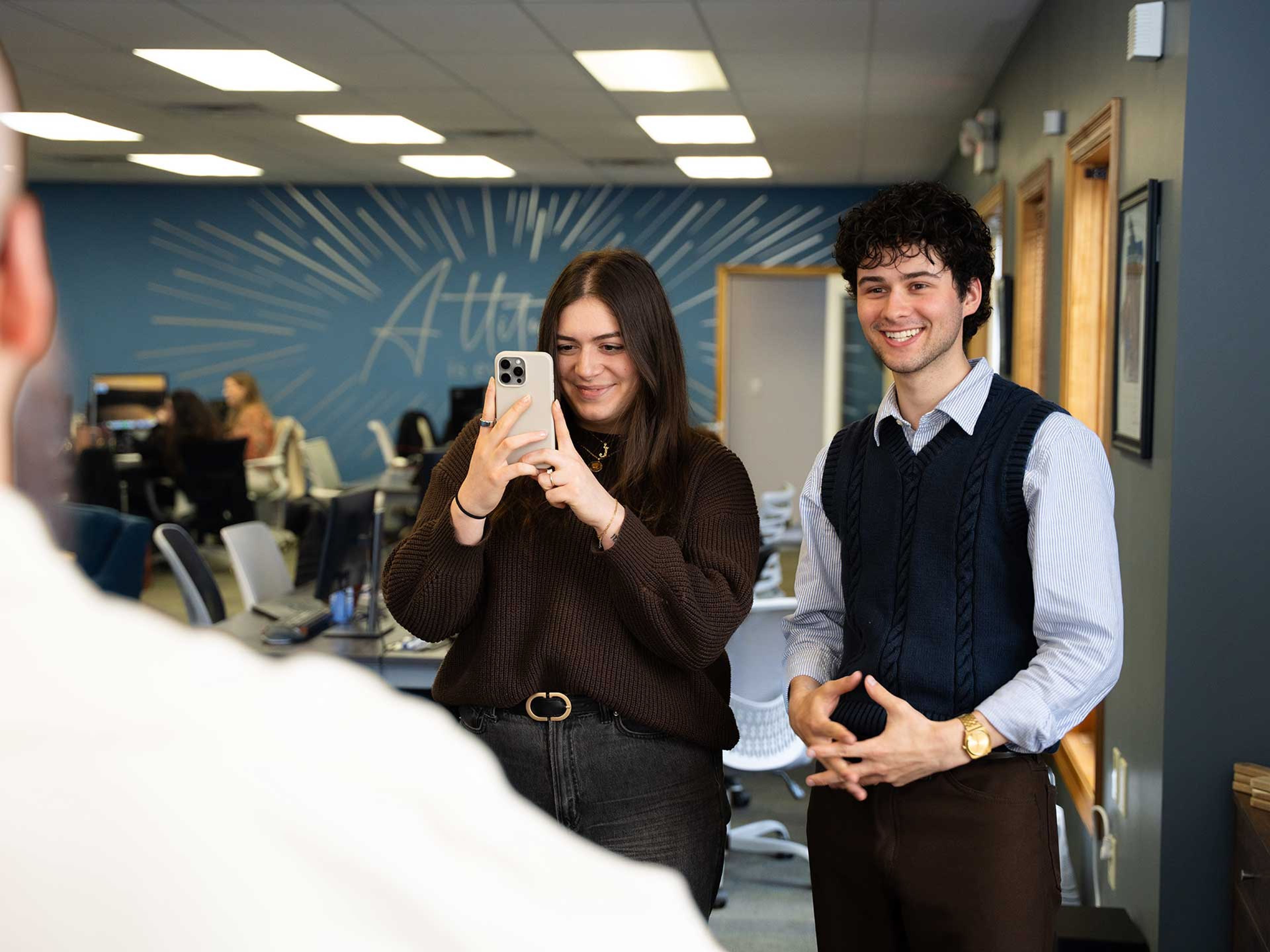 898 Marketing team member filming social media content in the Youngstown office