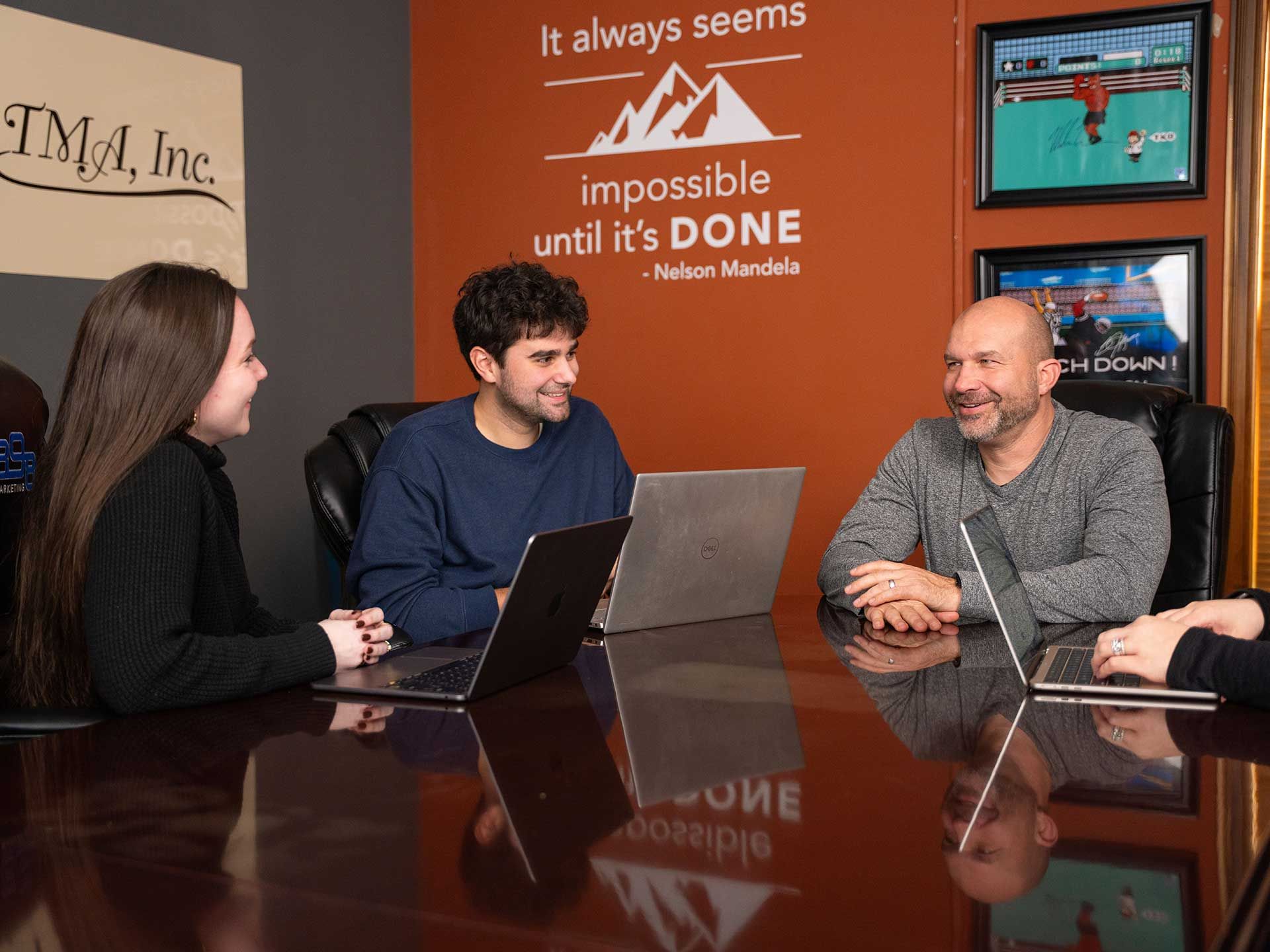 898 Marketing team meeting with a client at a conference table
