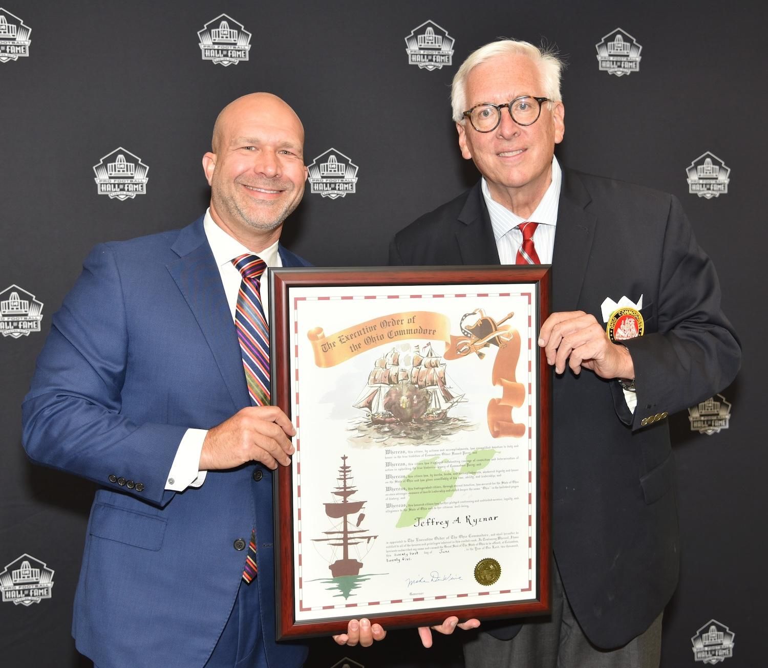 Jeff Ryznar being presented his induction into the Ohio Commodores