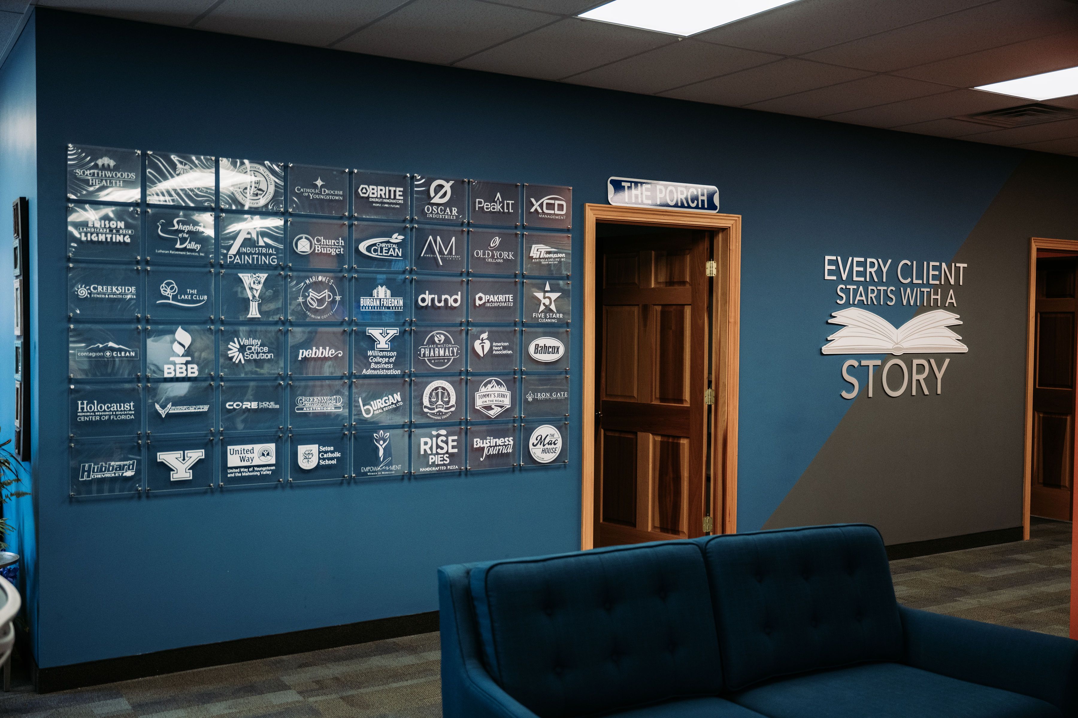 Partner plaque wall at the 898 Canfield office