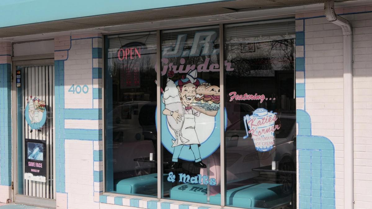 JR Grinder storefront window with retro 1950s diner mural in Canfield, Ohio