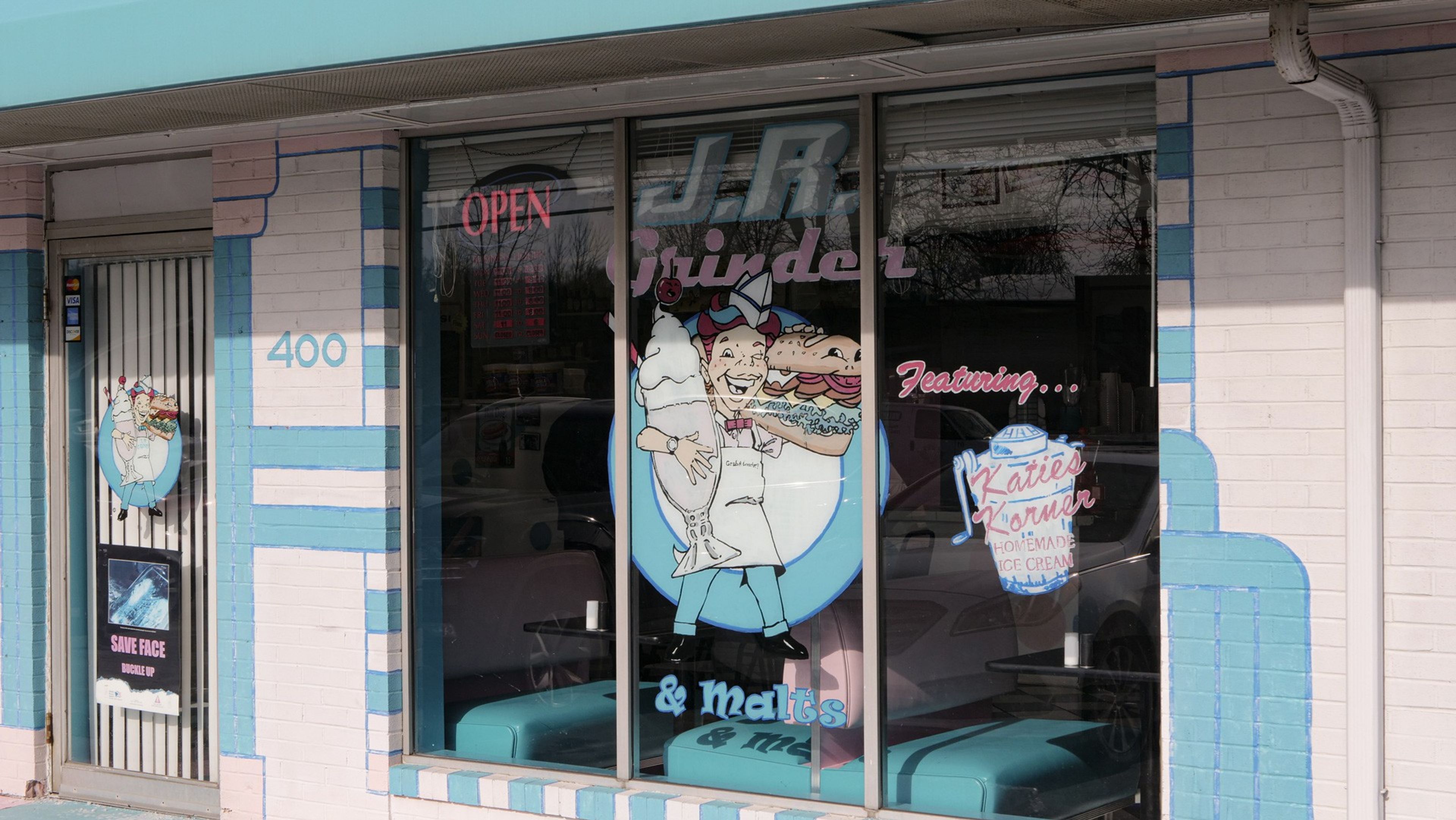 JR Grinder storefront window with retro 1950s diner mural in Canfield, Ohio