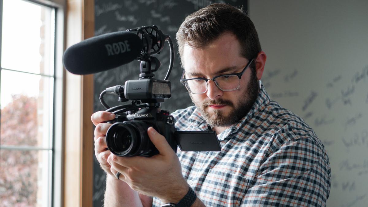 man holding video camera