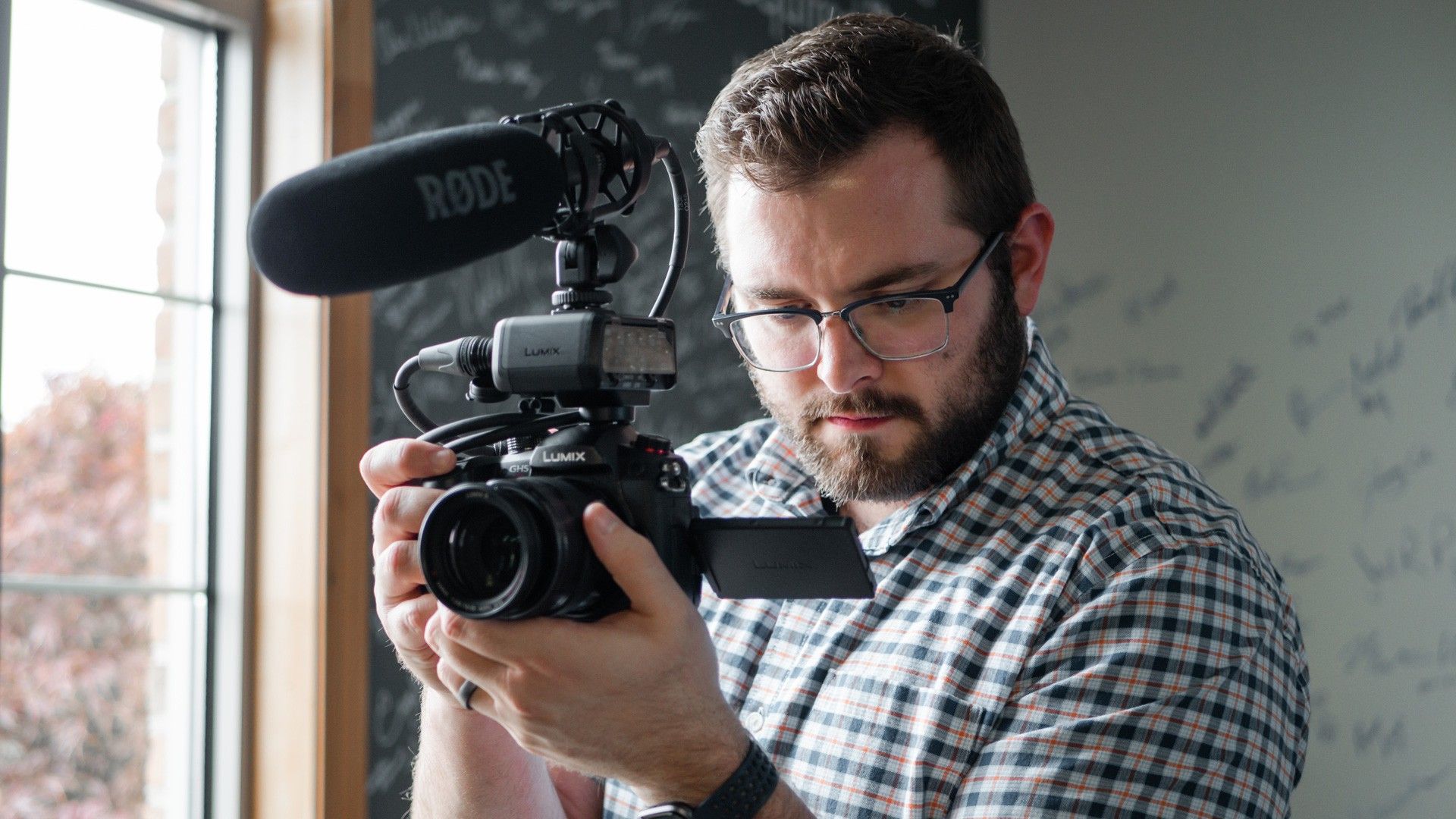 man holding video camera
