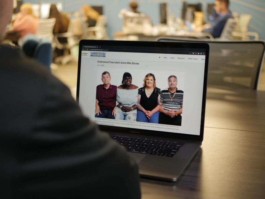 laptop opened up to blog in office 