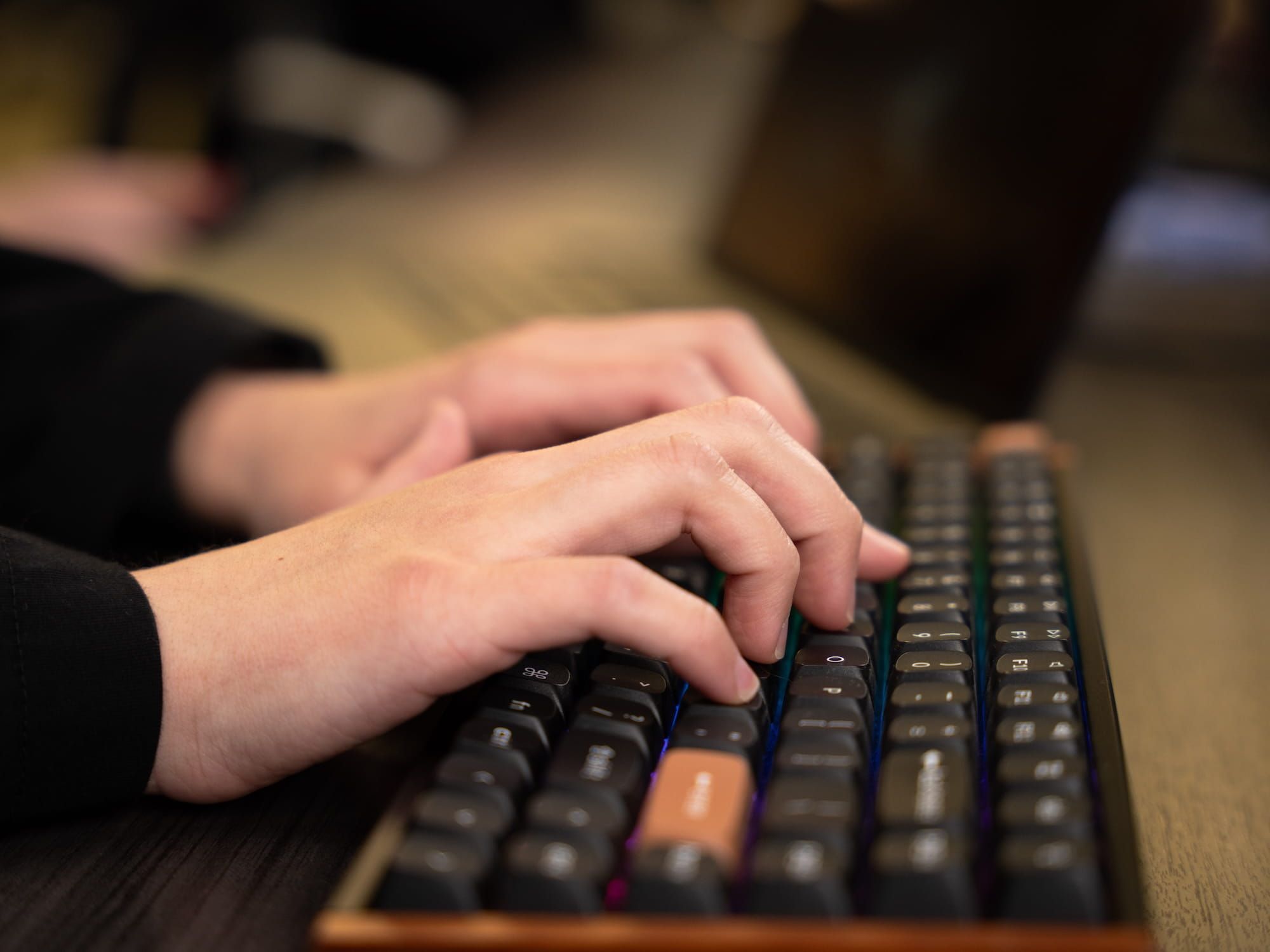 898 Marketing team member typing on a mechanical keyboard