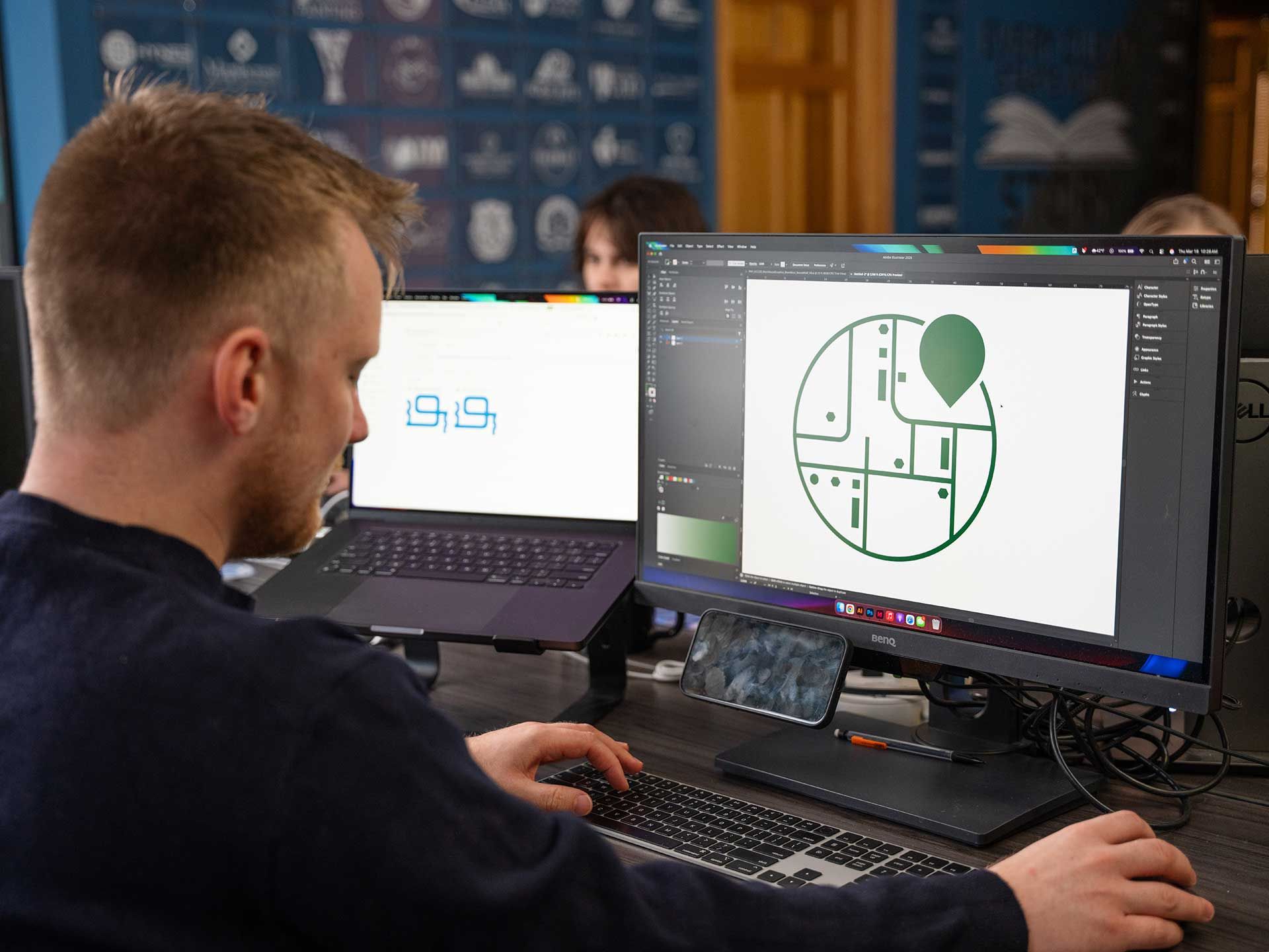 898 Marketing designer creating a logo in Adobe Illustrator