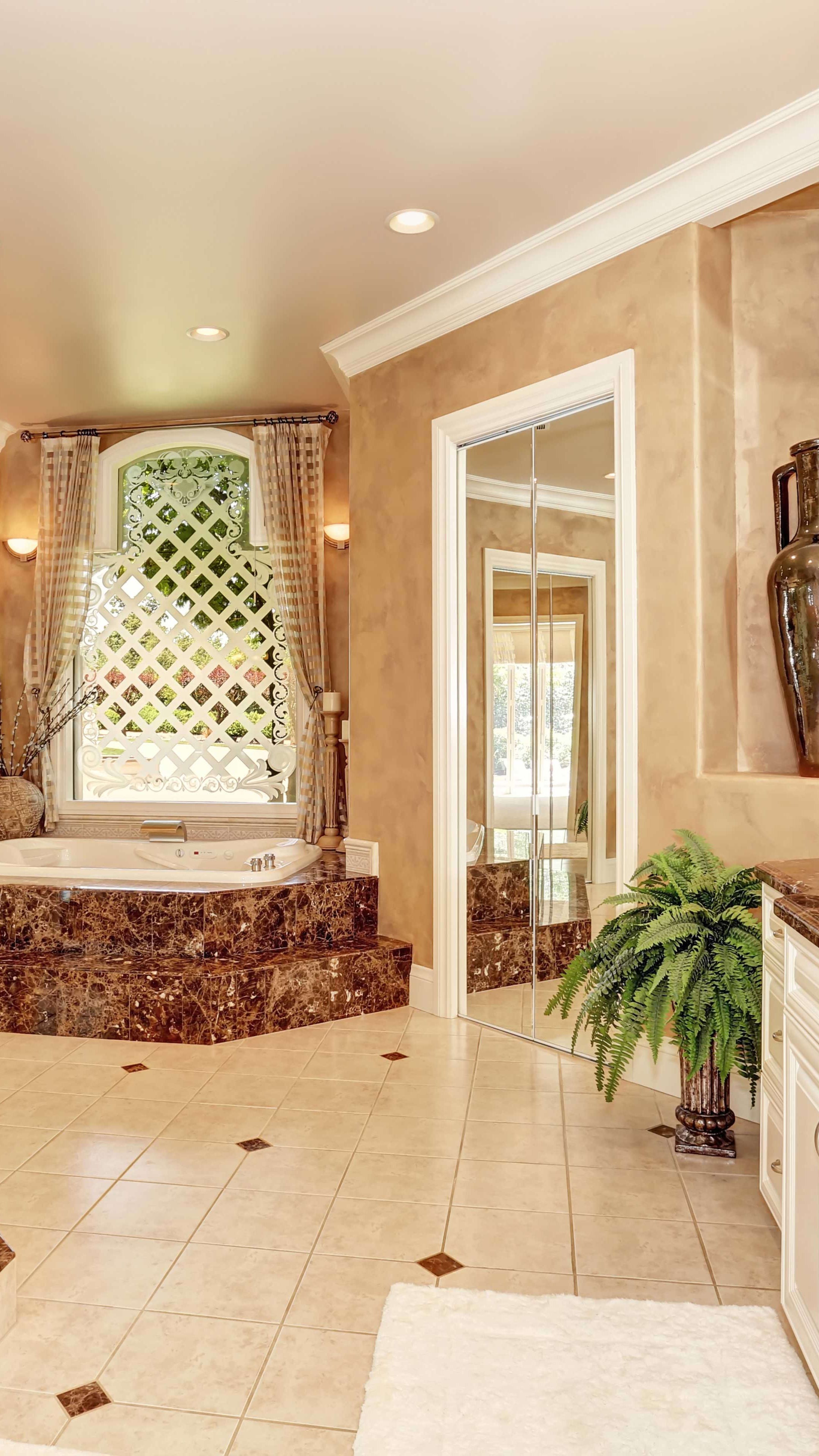 Marble bathroom accent wall and fixtures