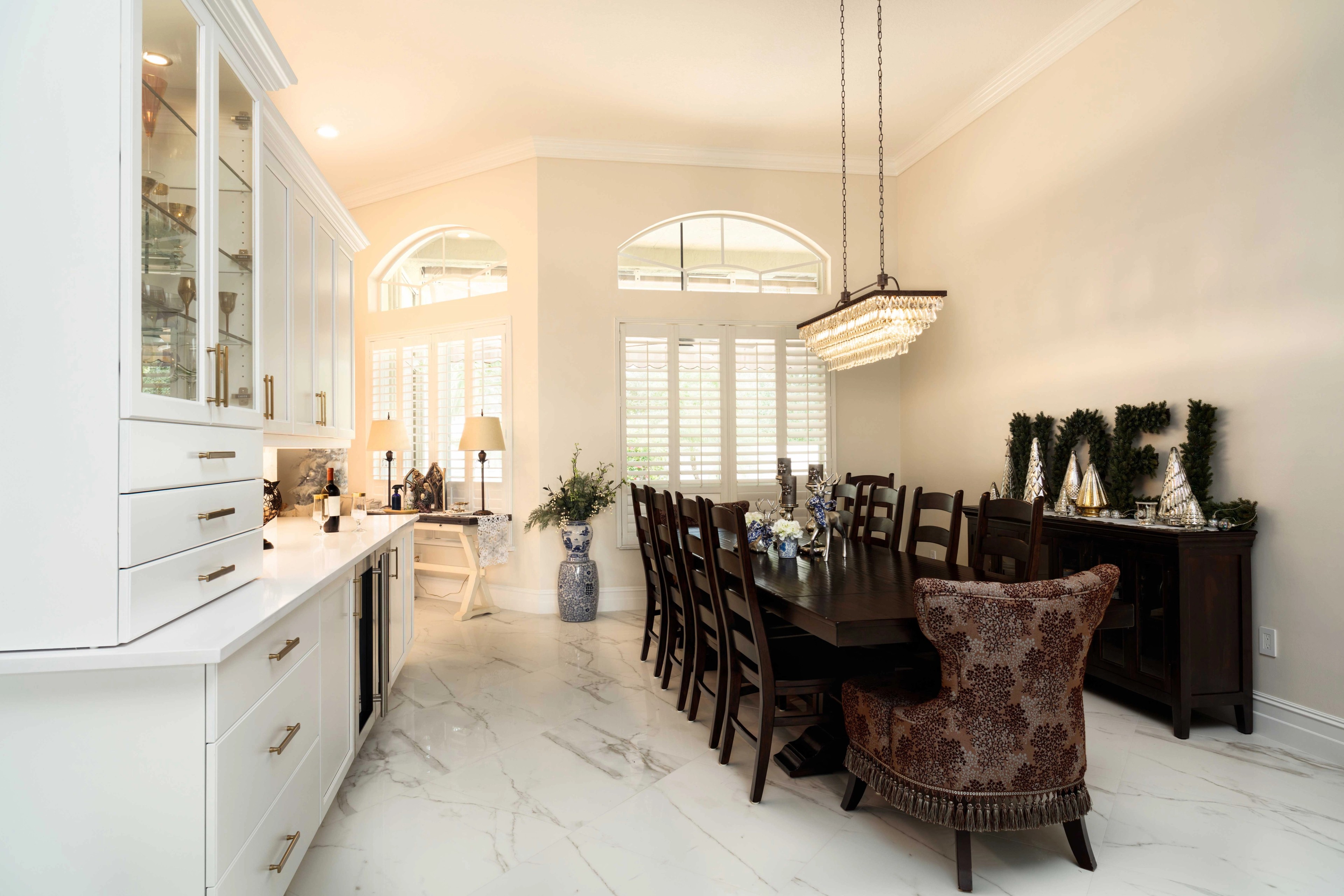 Marble tile kitchen island with pendant lighting