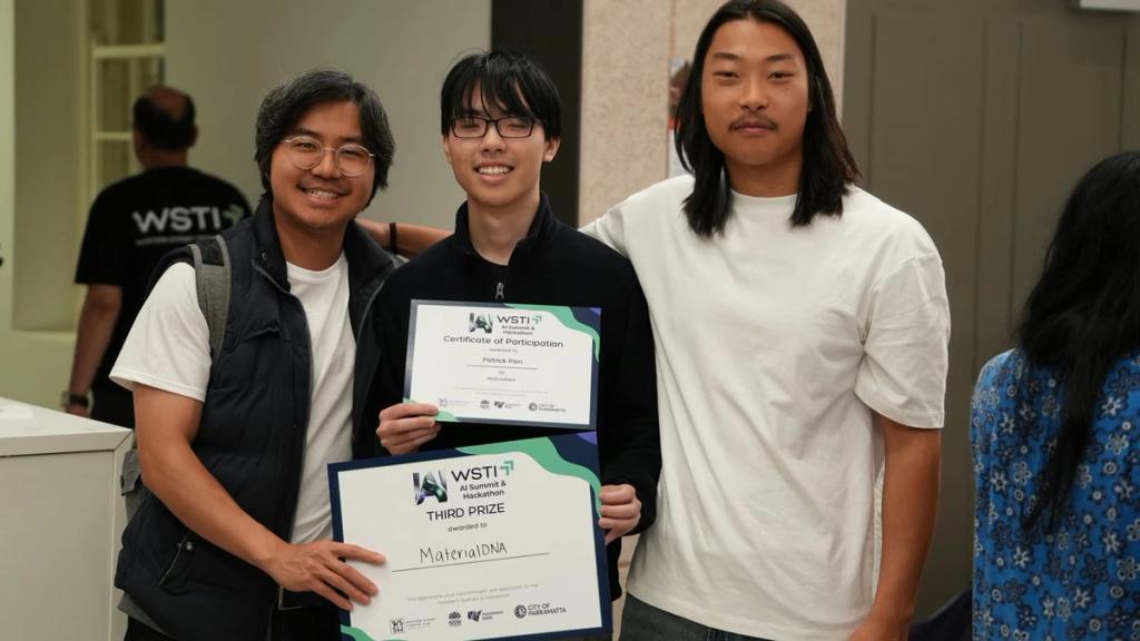 Three young builders holding their certificates