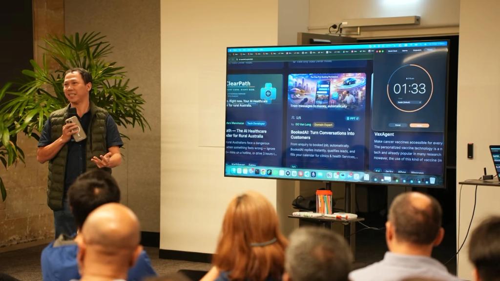 A team's demo on the big screen with the countdown clock running.
