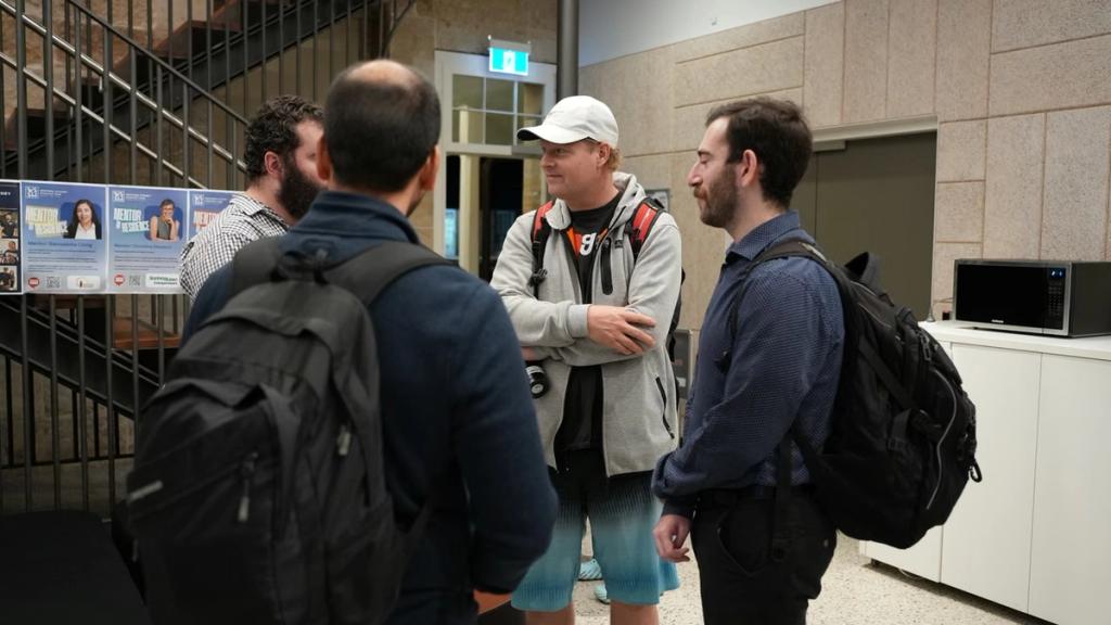 Attendees in conversation as they arrive